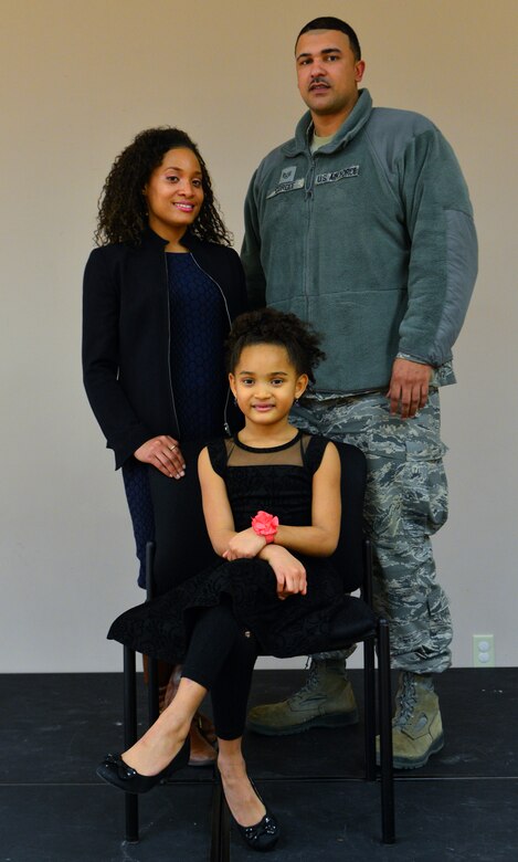 Kennedy Cordle poses with her mother, Mikka Cordle, and father, Staff Sgt. Brandon Cordle, 436th Civil Engineer Squadron power production craftsman, March 1, 2014, at the Youth Center on Dover Air Force Base, Del. Kennedy won first place in her age category for singing “Greatest Love of All” by Whitney Houston in the Air Force “U Got Talent” competition. (U.S. Air Force photo/Airman 1st Class William Johnson)