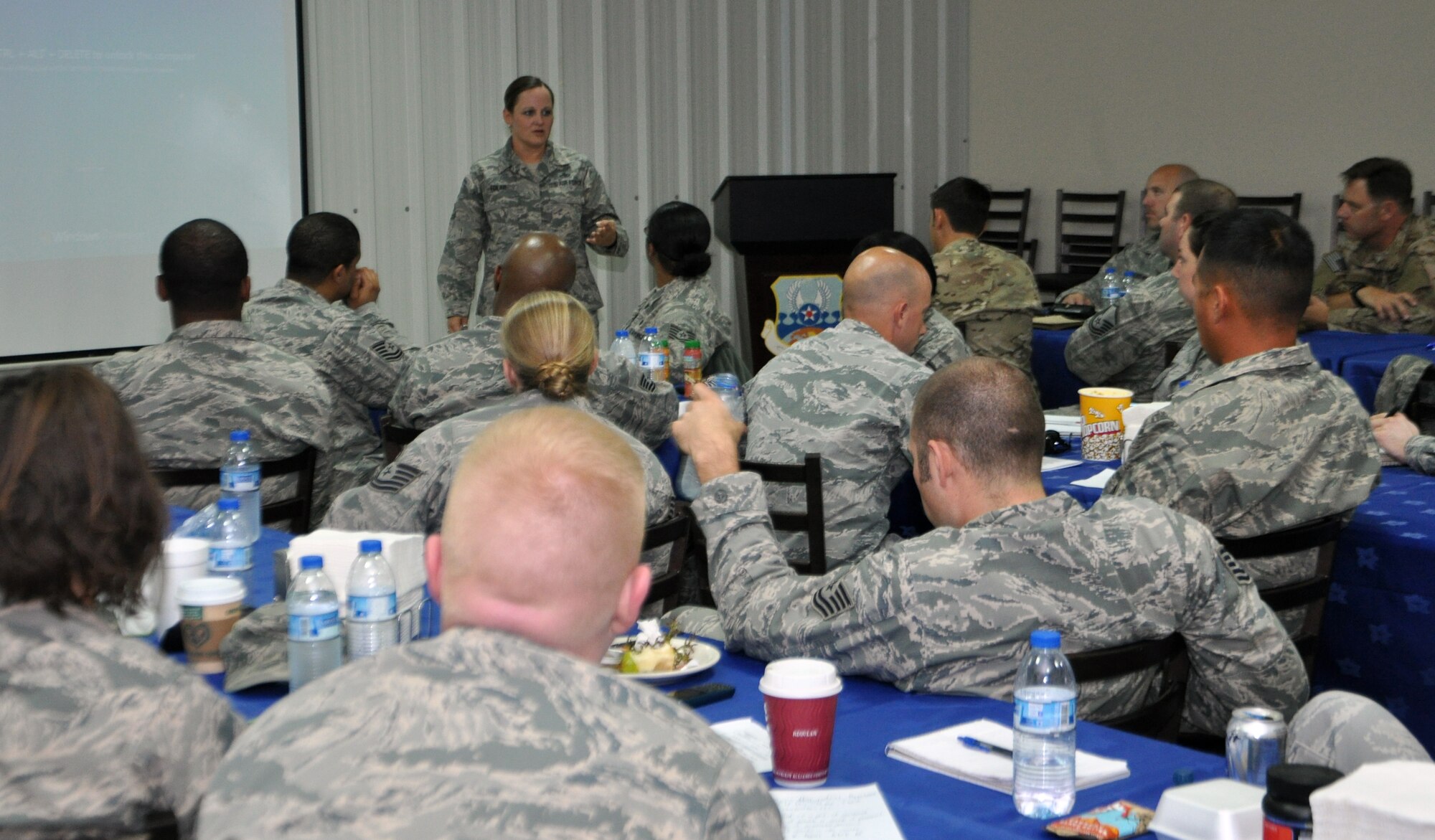 Air Force Master Sgt. Lynnette Tolar briefs Airmen during the Additional Duty First Sergeant Symposium here March 5, 2014. She is deployed to the 380th Expeditionary Communications Squadron as the first sergeant. (U.S. Air Force photo by Master Sgt. April Lapetoda/Released)
