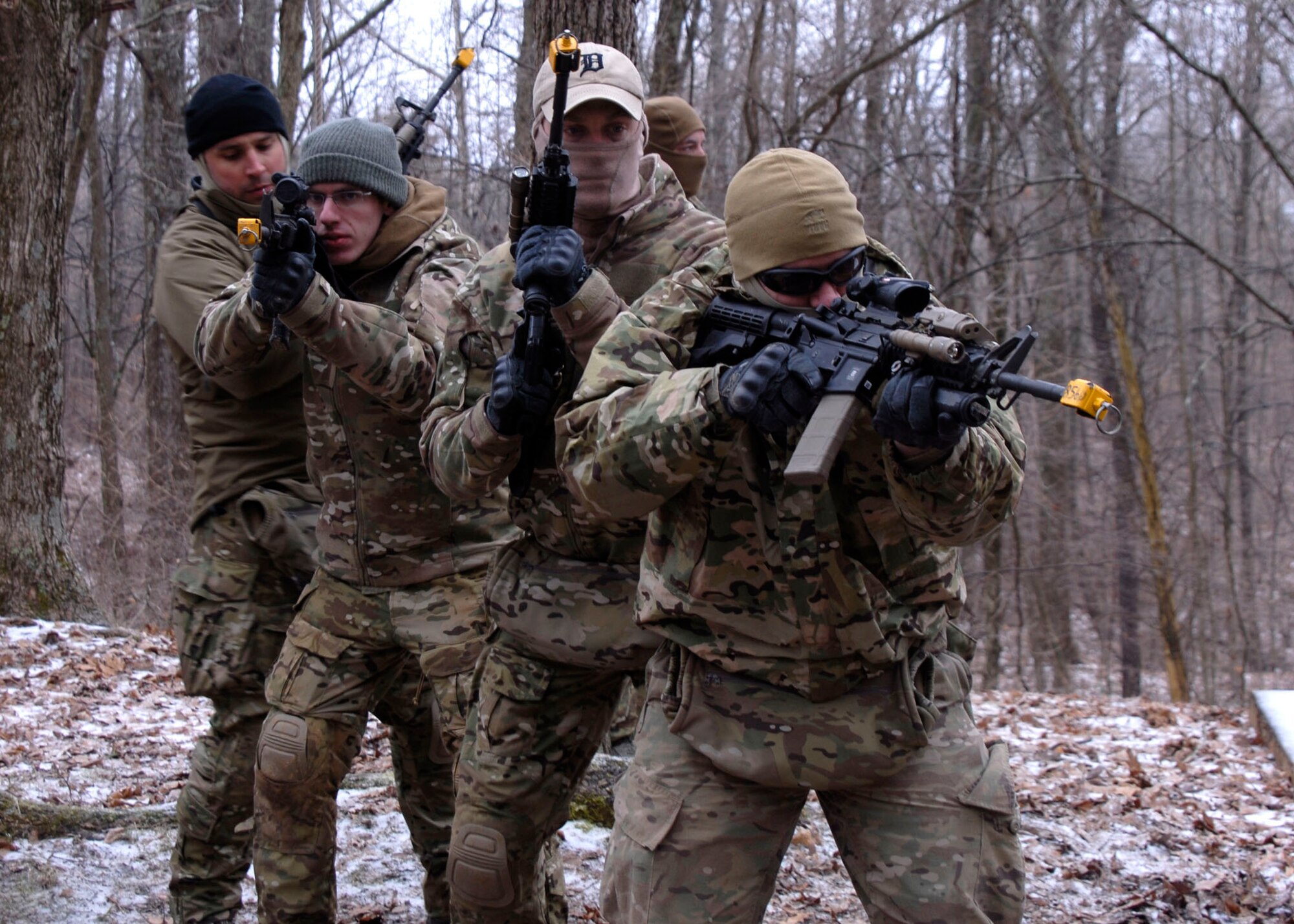 U.S. Air Force airmen from the 181st Intelligence Wing, 113th Air Support operations Squadron, Indiana Air National Guard rehearse breaching on a "glass house" March 2nd during Operation Rogue Banshee at Muscatatuck urban Training Center in Butlerville, Ind.  The focus of the joint training was Close Air Support incorporation into urban combat operations and other small unit scenarios. (U.S. Air National Guard photo by Airman 1st Class Joe Boals/Released)
