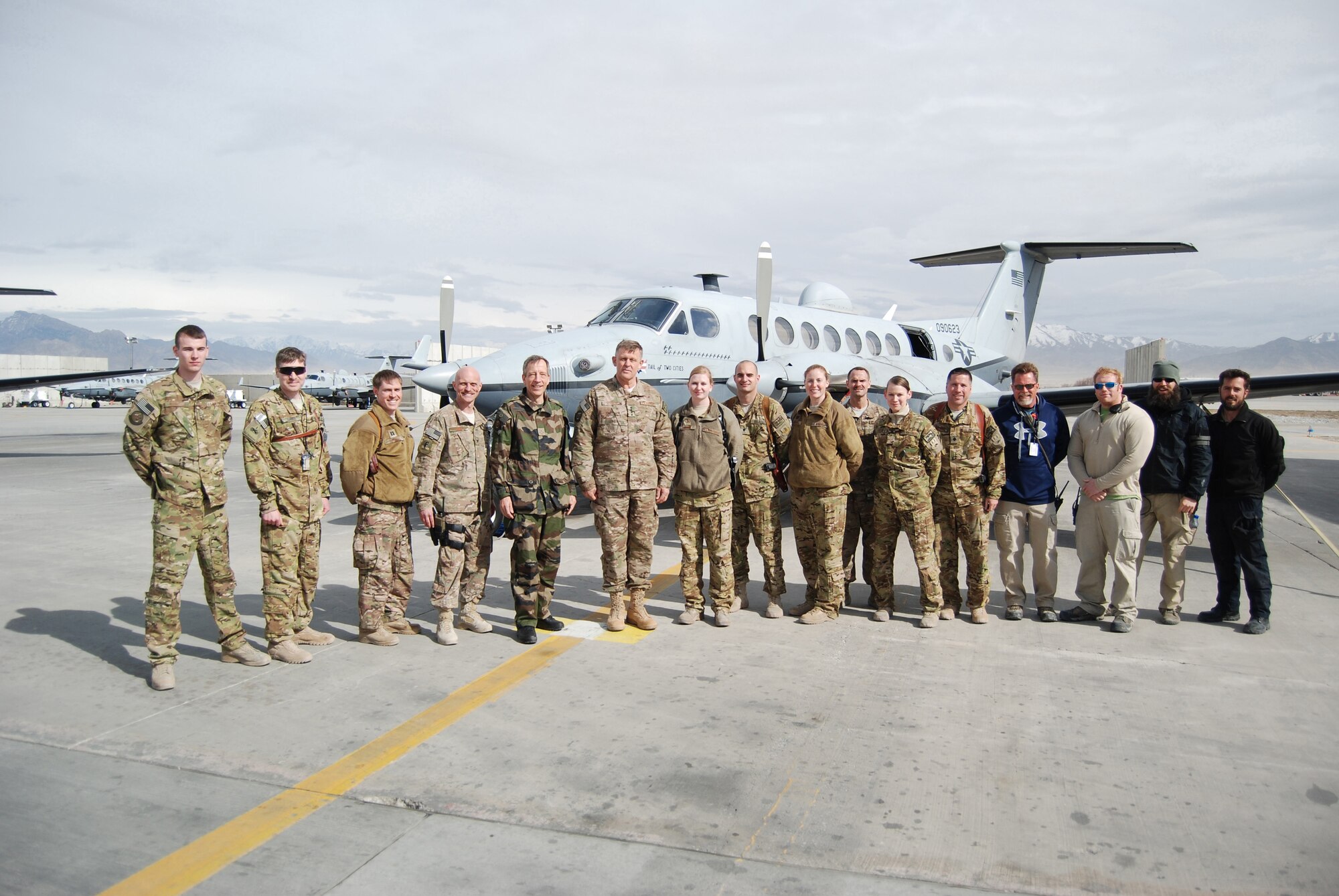 U.S. Air Force Gen. Frank Gorenc, NATO Allied Air Command and U.S. Air Forces in Europe-Air Forces Africa commander, and French Lt. Gen. Dominique de Longvilliers, NATO Allied Air Command deputy commander, pose for a photo with MC-12W Liberty crews during a visit to Bagram Airfield, March 10, 2014. During the visit, they had lunch with company grade officers, received a tour of the MC-12W squadron and met with 455th Air Expeditionary Wing leadership. (U.S. Air Force photo by Capt. Brian Wagner/Released) (Some last names blurred on photo for operational security.)