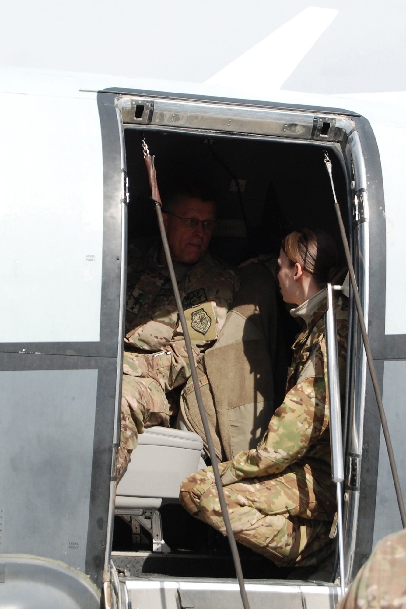 U.S. Air Force Gen. Frank Gorenc, NATO Allied Air Command and U.S. Air Forces in Europe-Air Forces Africa commander, talks with a MC-12W Liberty crew member during a visit to Bagram Airfield, March 10, 2014. During the visit, Gorenc had lunch with company grade officers, received a tour of the MC-12W squadron and met with 455th Air Expeditionary Wing leadership. (U.S. Air Force photo by Capt. Brian Wagner/Released)