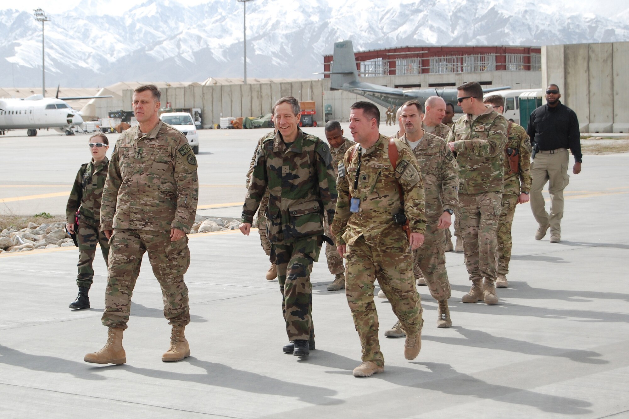 Lt. Col. Patrick Boland, 4th Expeditionary Reconnaissance Squadron commander, talks to U.S. Air Force Gen. Frank Gorenc, NATO Allied Air Command and U.S. Air Forces in Europe-Air Forces Africa commander, and French Lt. Gen. Dominique de Longvilliers, NATO Allied Air Command deputy commander, prior to conducting a walkthrough of a MC-12W Liberty at Bagram Airfield, March 10, 2014. During the visit, they had lunch with company grade officers, received a tour of the MC-12W squadron and met with 455th Air Expeditionary Wing leadership. (U.S. Air Force photo by Capt. Brian Wagner/Released) (Badge blurred for operational security reasons.)