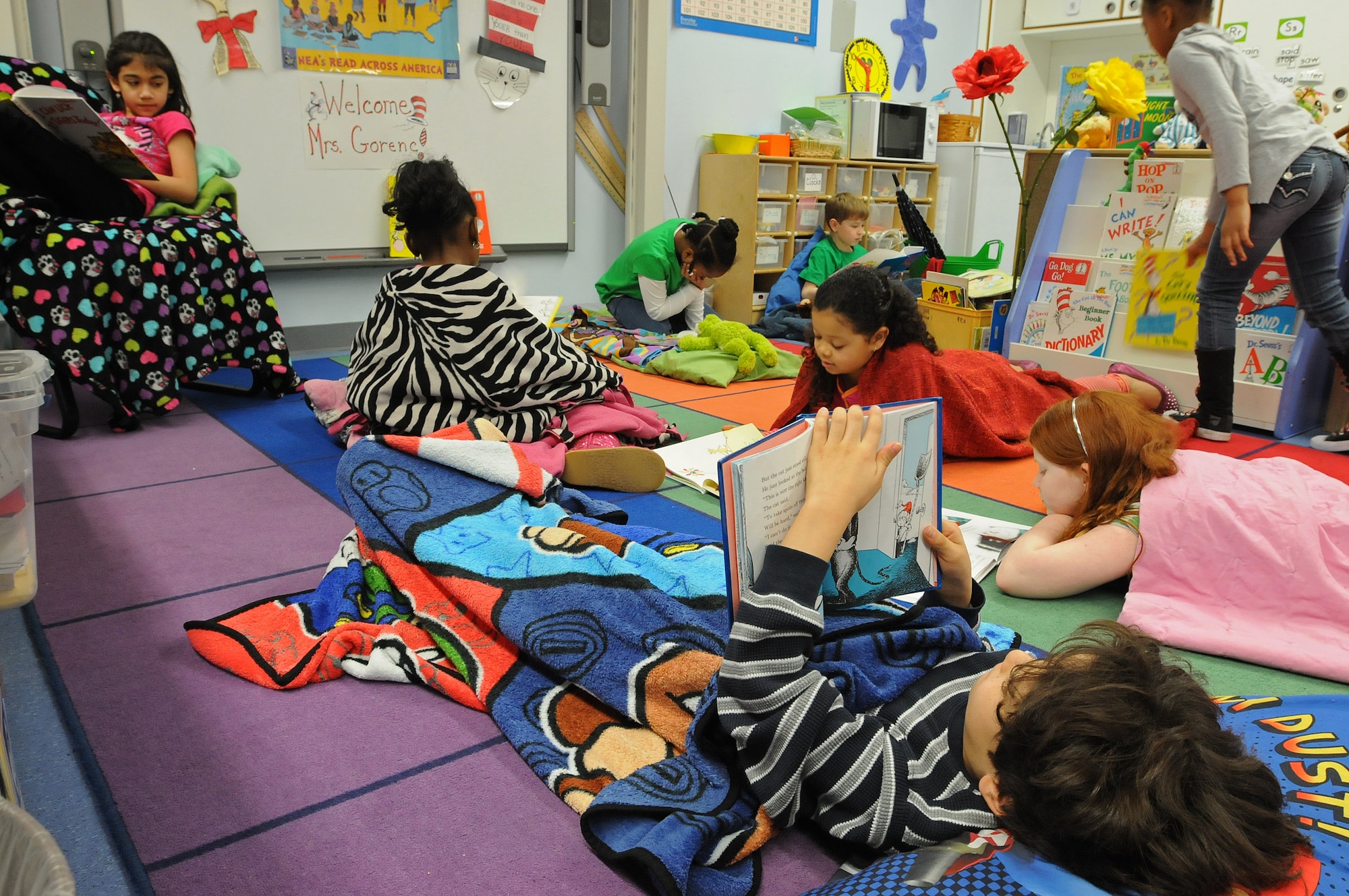 Students of Cheryl Woodruf’s second grade class at Ramstein Elementary School read books during Read Across America week Mar. 3, 2014, Ramstein Air Base, Germany. Read Across America is a week-long celebration, held the week of Dr. Seuss’ birthday, to teach children the importance of reading and education in schools across America and U.S. military installations overseas. (U.S. Air Force photo/Airman 1st Class Holly Mansfield)