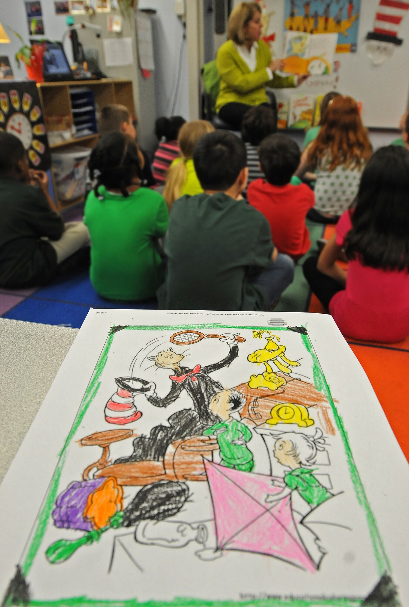 Sharon Gorenc, wife of Gen. Frank Gorenc, U.S. Air Forces in Europe and Air Forces Africa commander, reads to children from Cheryl Woodruf’s second grade class to help kick off Read Across America at Ramstein Elementary School, Mar. 3, 2014, Ramstein Air Base, Germany. Read Across America is a week-long celebration, held the week of Dr. Seuss’ birthday, to teach children the importance of reading and education in schools across America and U.S. military installations overseas. (U.S. Air Force photo/Airman 1st Class Holly Mansfield)