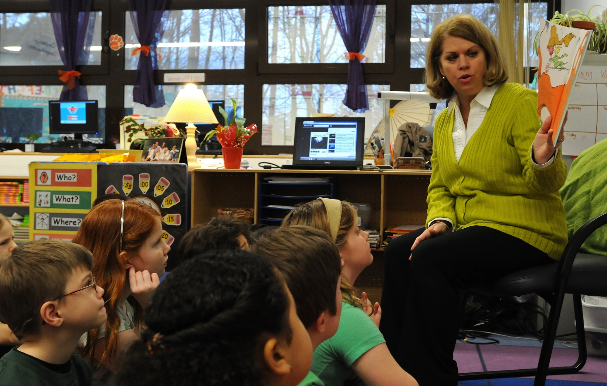 Sharon Gorenc, wife of Gen. Frank Gorenc, U.S. Air Forces in Europe and Air Forces Africa commander, reads to children from Cheryl Woodruf’s second grade class to help kick off Read Across America at Ramstein Elementary School, Mar. 3, 2014, Ramstein Air Base, Germany. Read Across America is a week-long celebration, held the week of Dr. Seuss’ birthday, to teach children the importance of reading and education in schools across America and U.S. military installations overseas. (U.S. Air Force photo/Airman 1st Class Holly Mansfield)