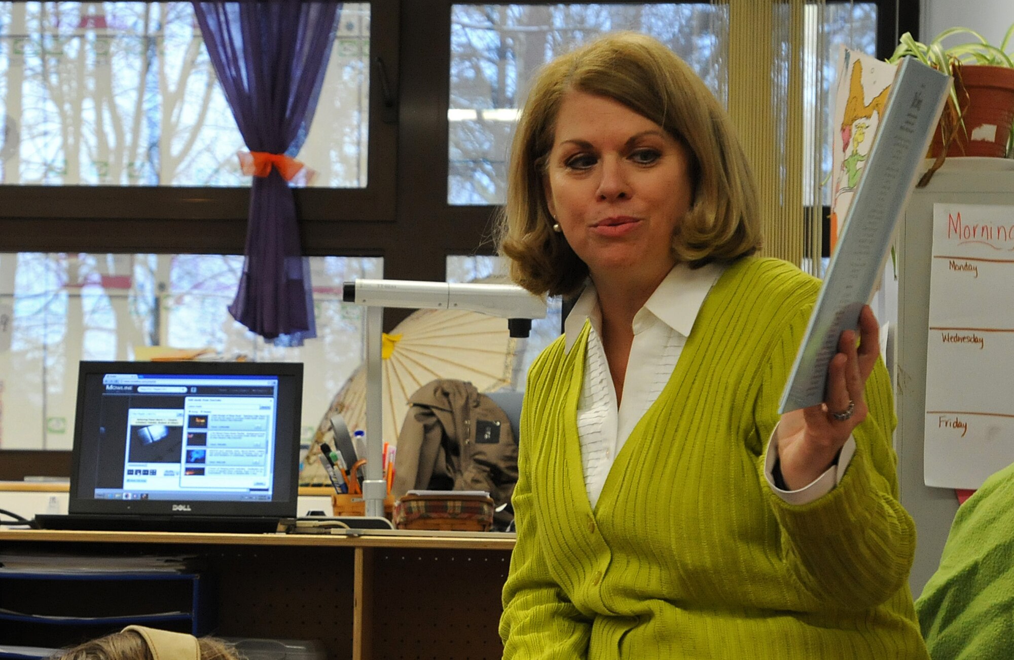 Sharon Gorenc, wife of Gen. Frank Gorenc, U.S. Air Forces in Europe and Air Forces Africa commander, reads to children from Cheryl Woodruf’s second grade class to help kick off Read Across America at Ramstein Elementary School, Mar. 3, 2014, Ramstein Air Base, Germany. Read Across America is a week-long celebration, held the week of Dr. Seuss’ birthday, to teach children the importance of reading and education in schools across America and U.S. military installations overseas. (U.S. Air Force photo/Airman 1st Class Holly Mansfield)