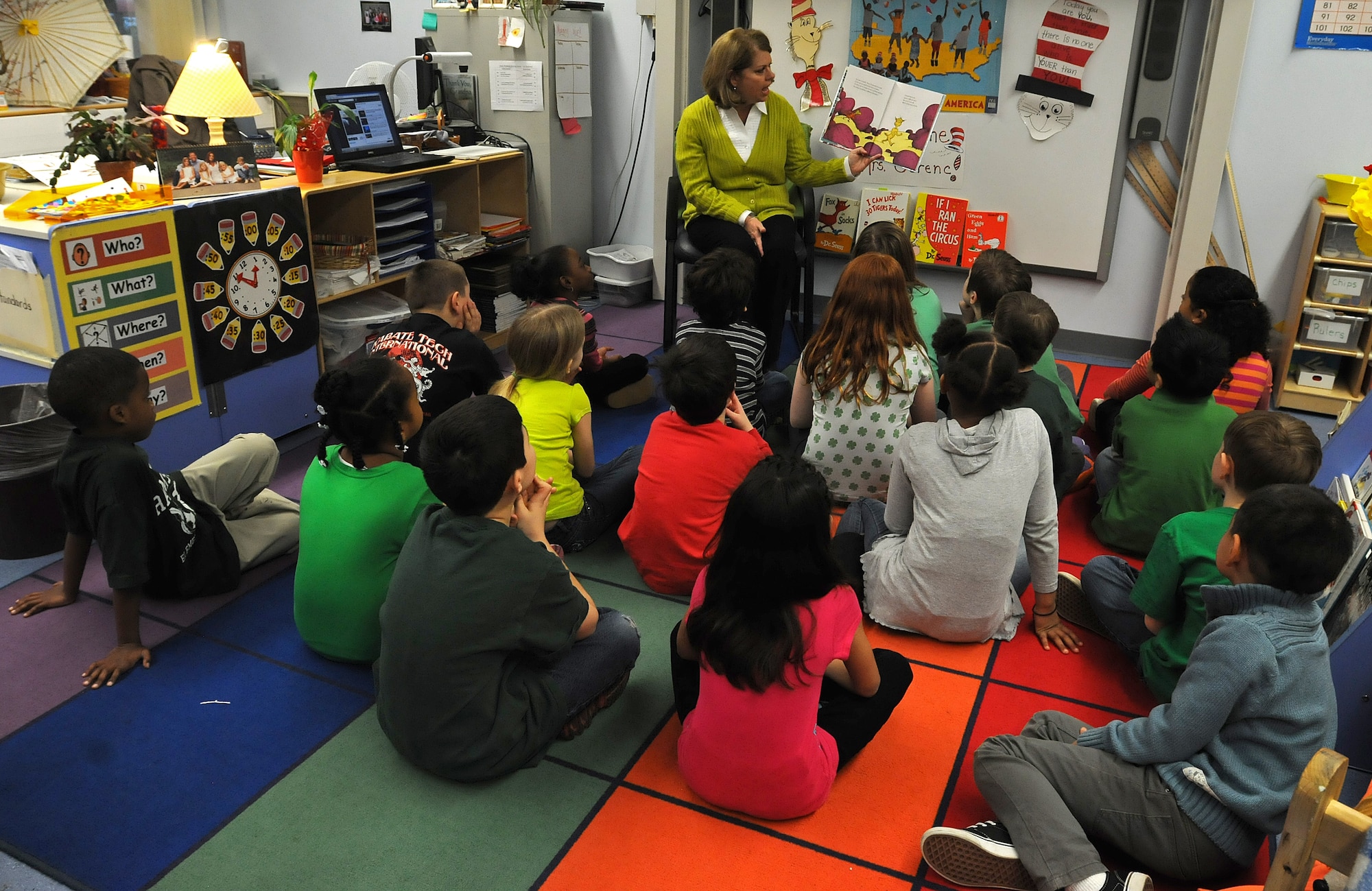 Sharon Gorenc, wife of Gen. Frank Gorenc, U.S. Air Forces in Europe and Air Forces Africa commander, reads to children from Cheryl Woodruf’s second grade class to help kick off Read Across America at Ramstein Elementary School, Mar. 3, 2014, Ramstein Air Base, Germany. Read Across America is a week-long celebration, held the week of Dr. Seuss’ birthday, to teach children the importance of reading and education in schools across America and U.S. military installations overseas. (U.S. Air Force photo/Airman 1st Class Holly Mansfield)