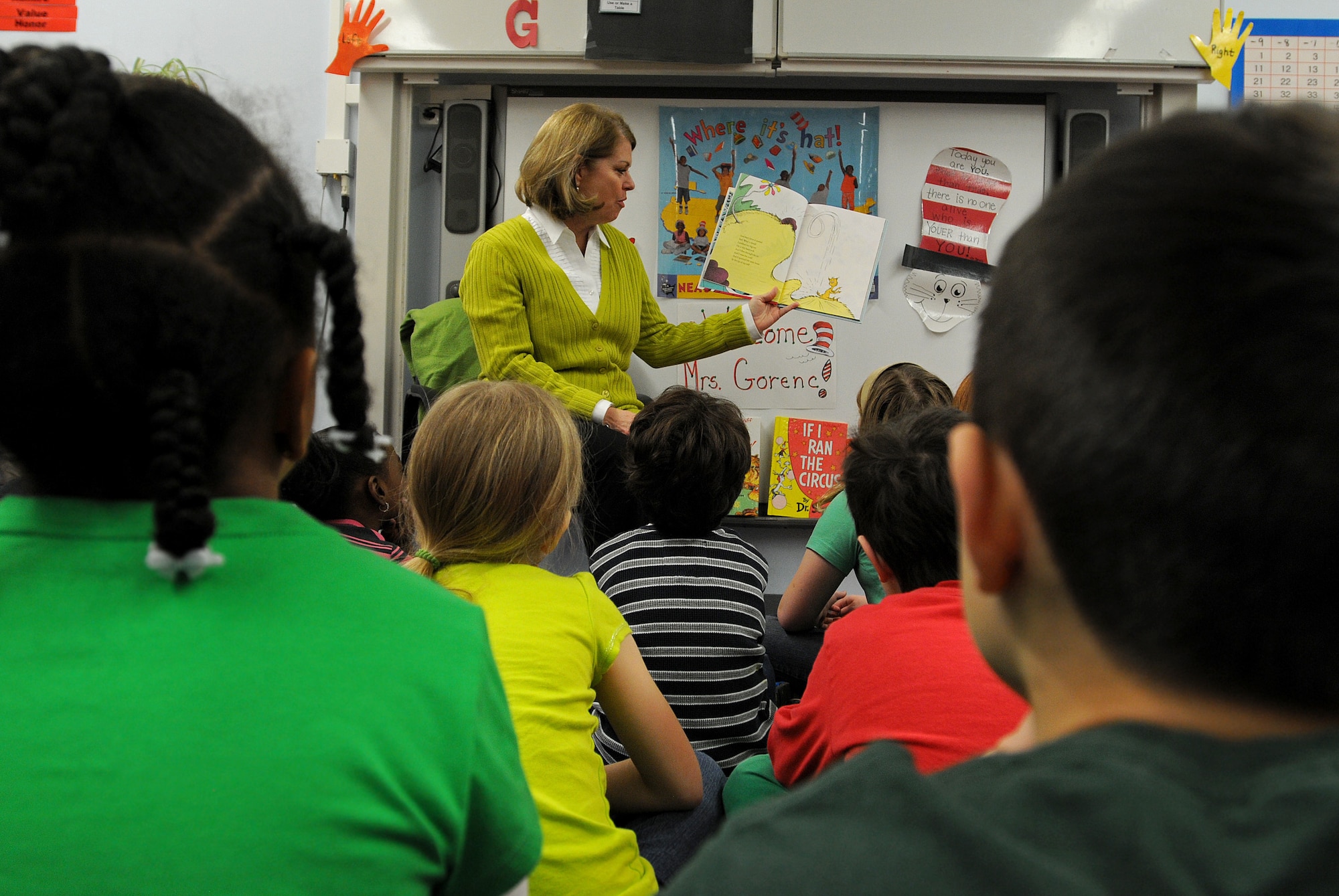 Sharon Gorenc, wife of Gen. Frank Gorenc, U.S. Air Forces in Europe and Air Forces Africa commander, reads to children from Cheryl Woodruf’s second grade class to help kick off Read Across America at Ramstein Elementary School, Mar. 3, 2014, Ramstein Air Base, Germany. Read Across America is a week-long celebration, held the week of Dr. Seuss’ birthday, to teach children the importance of reading and education in schools across America and U.S. military installations overseas. (U.S. Air Force photo/Airman 1st Class Holly Mansfield)