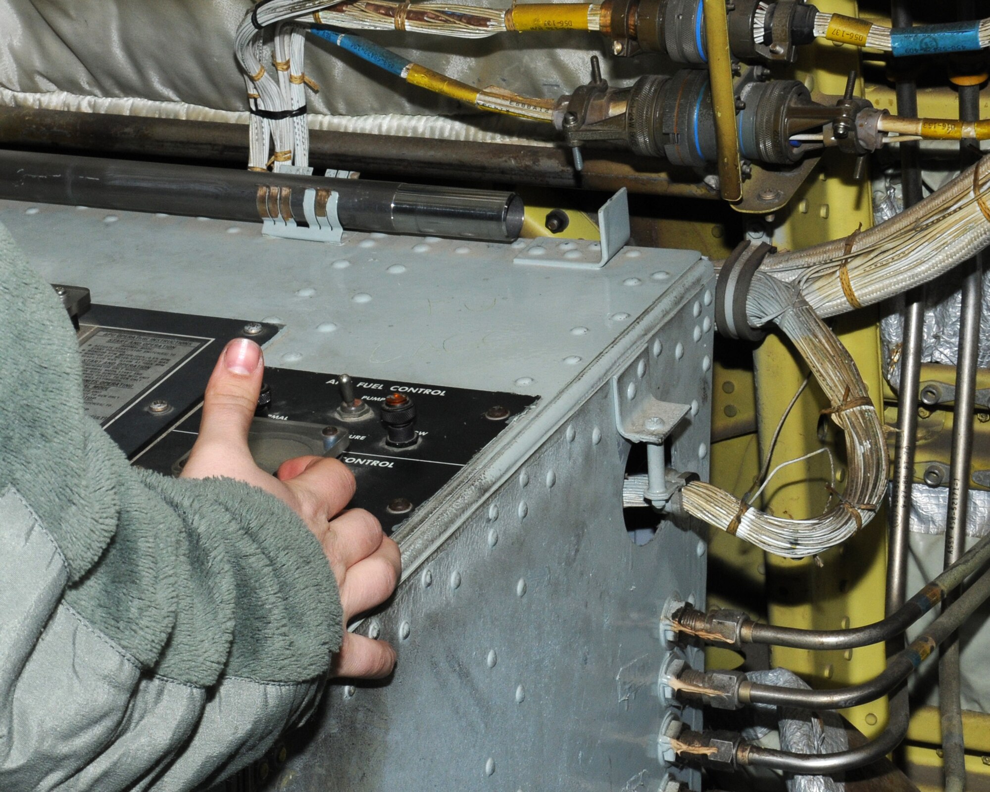U.S. Air Force Senior Airman Jessica Tharp, 100th Aircraft Maintenance Squadron aerospace propulsion journeyman from Lancaster, Ohio, starts an auxiliary power unit for aircraft power on a KC-135 Stratotanker March 4, 2014, on RAF Mildenhall, England. Their tankers provide air refueling to U.S. and NATO aircraft in the European theater and parts of Africa, which allows the expeditionary Air Force to deploy around the world at a moment’s notice. (U.S. Air Force photo by Gina Randall/Released)