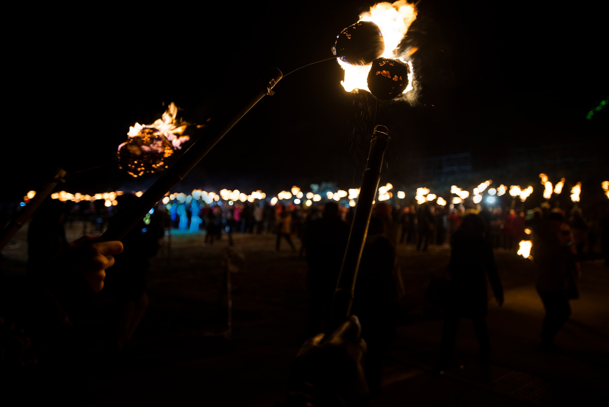 Participants light their torches for the Fire Festival March 9, 2014, in Jeju, Republic of Korea. At the end of the festival, participants carried flaming torches to the mountain side and lit it on fire. (U.S. Air Force photo by Staff Sgt. Jake Barreiro)