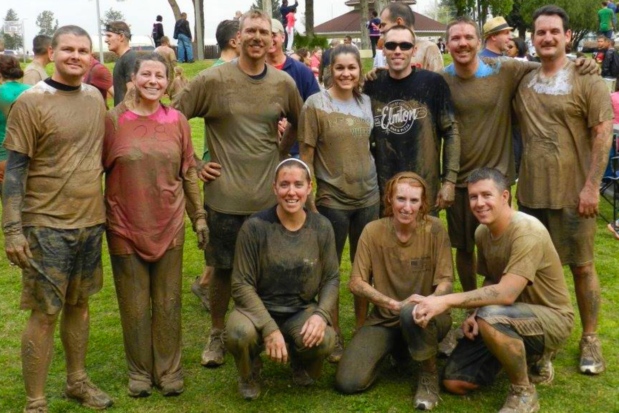 Master Sgt. Chris Rekrut (bottom right), 728th Air Mobility Squadron Quality Assurance superintendent, poses with his wife, Corrine, and other members of the 728th AMS after the Dirty Dash run May 18, 2013, Incirlik Air Base, Turkey. Rekrut was recently promoted by means of the Stripes for Exceptional Performers program for his sustained exceptional performance at work and his involvement in the community. (Courtesy photo)