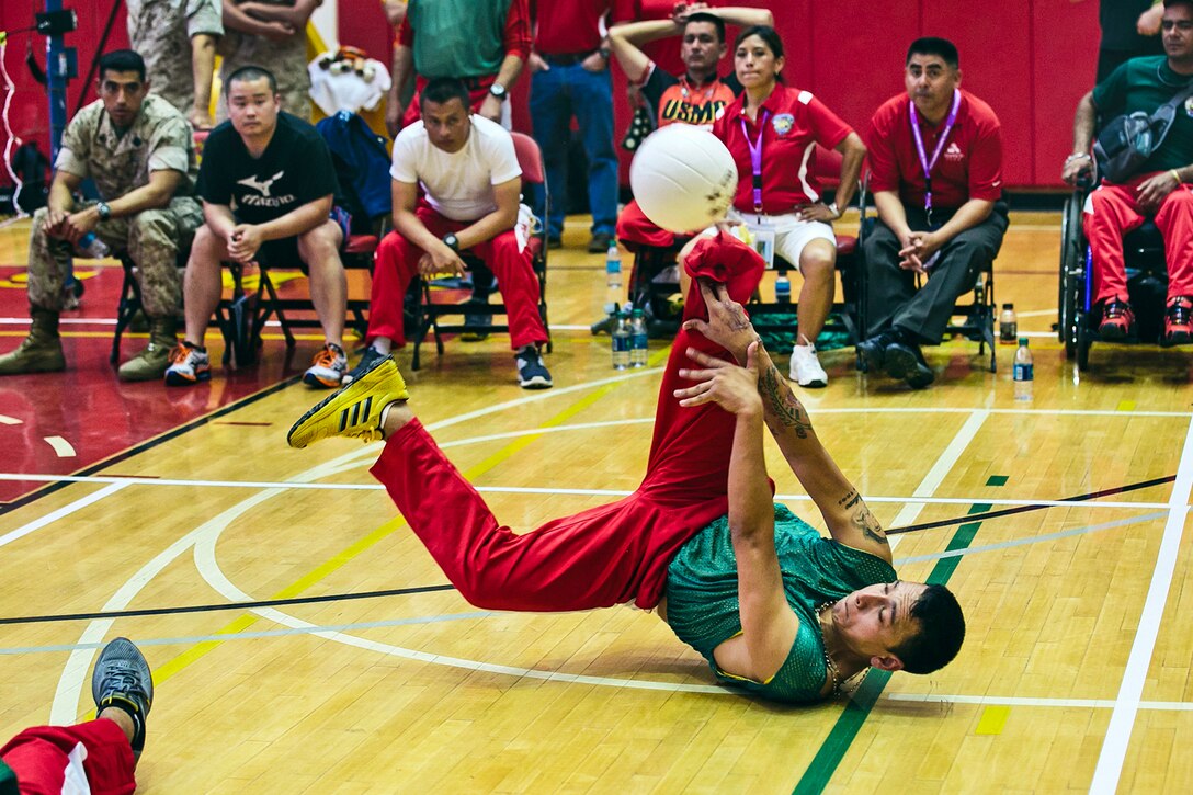 Marine Corps wounded warriors from Team Allies, Team Colombia and Team Veterans participate in the sitting volleyball competition at the 2014 Marine Corps Trials on Camp Pendleton, Calif., March 9, 2014.