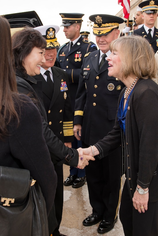 Deanie Dempsey, right, wife of U.S. Army Gen. Martin E. Dempsey, second from right, chairman of the Joint Chiefs of Staff, welcomes Kim Kye-soon, wife of Dempsey's South Korean counterpart, Navy Adm. Choi Yoon-hee, second from left, at the Pentagon, March 11, 2014.