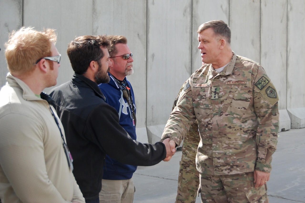 U.S. Air Force Gen. Frank Gorenc, NATO Allied Air Command and U.S. Air Forces in Europe-Air Forces Africa commander, shakes hands with MC-12W Liberty maintenance crews during a visit to Bagram Airfield, March 10, 2014. During the visit, Gorenc had lunch with company grade officers, received a tour of the MC-12W squadron and met with 455th Air Expeditionary Wing leadership. (U.S. Air Force photo by Capt. Brian Wagner/Released)