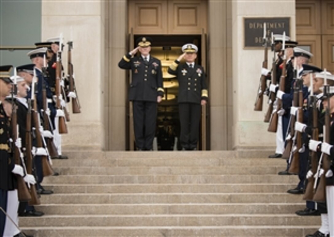 U.S. Army Gen. Martin E. Dempsey, right, chairman of the Joint Chiefs of Staff, salutes with his South Korean counterpart, Navy Adm. Choi Yoon-hee, during an honor cordon at the Pentagon, March 11, 2014. Choi was making his first trip to the Pentagon as chairman of South Korea's joint chiefs.