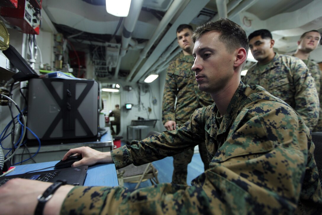 Corporal Josh B. Fenstermaker, a data technician serving as the data communications chief for the 31st Marine Expeditionary Unit on the USS Denver (LPD-9), and a native of Columbus, Ohio, creates accounts for other embarked Marines here, Mar. 4. Since boarding the ship one week ago, Fenstermaker has supervised the creation of a data network that supports hundreds of Marines and sailors from all four elements of the 31st MEU’s Marine Air Ground Task Force. Embarked on the USS Denver are elements of Battalion Landing Team 2/5, as well as small detachments from the Command Element, Combat Logistics Battalion 31, and Marine Medium Tiltrotor Squadron 265 (Reinforced). The 31st MEU is the Marine Corps’ force in readiness for the Asia-Pacific region and the only continuously forward-deployed MEU.
