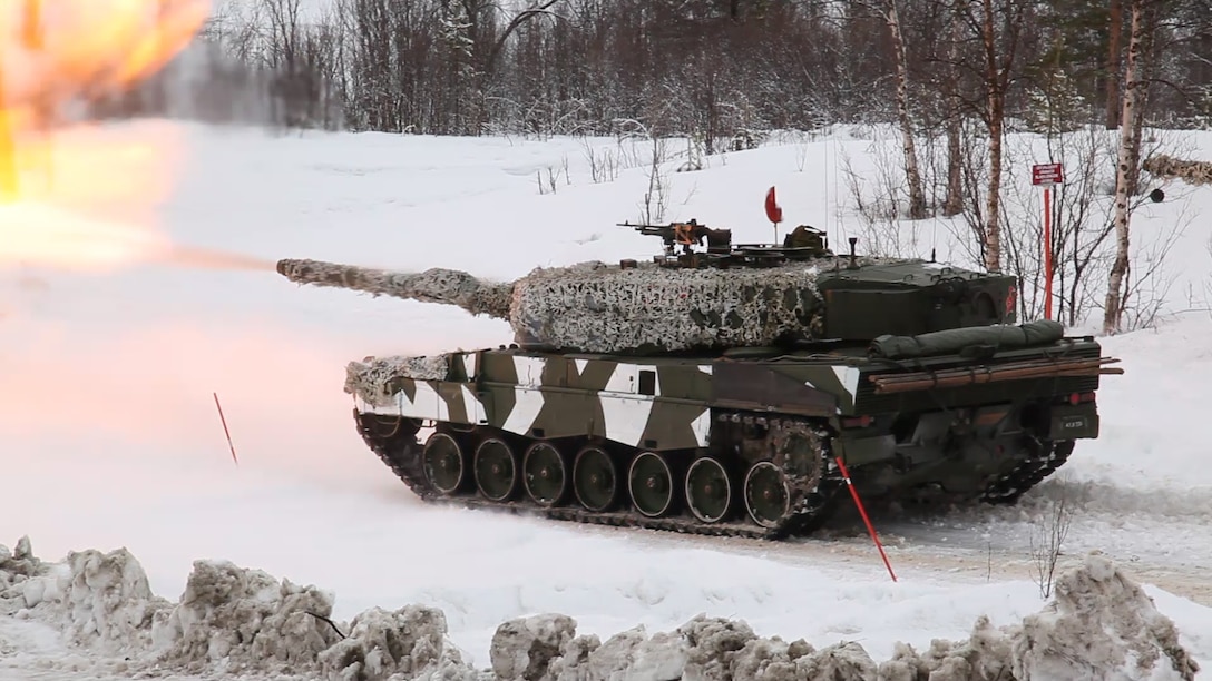 Norwegian tanks take part in a live-fire capabilities demonstration during Cold Response 14, a multinational and multilateral training exercise above the Arctic Circle that brings together more than 14,000 servicemembers from 15 different countries, to include approximately 1,200 NATO personnel, March 11. The Norwegian-led exercise involves maritime, land and air operations being conducted this month to rehearse high-intensity operations in unique winter conditions, showcasing the diplomatic relationships, strategic friendships, and commitment to global security interests of all participating nations. The majority of the servicemembers are participating from the United States, Norway, Canada, France, the Netherlands, Great Britain and Sweden. (Official Air Force Photograph by Tech Sgt. Burt Traynor)