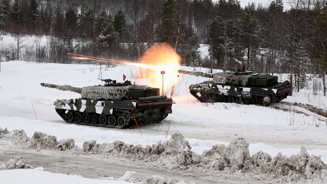 Norwegian tanks take part in a live-fire capabilities demonstration during Cold Response 14, a multinational and multilateral training exercise above the Arctic Circle that brings together more than 14,000 servicemembers from 15 different countries, to include approximately 1,200 NATO personnel, March 11. The Norwegian-led exercise involves maritime, land and air operations being conducted this month to rehearse high-intensity operations in unique winter conditions, showcasing the diplomatic relationships, strategic friendships, and commitment to global security interests of all participating nations. The majority of the servicemembers are participating from the United States, Norway, Canada, France, the Netherlands, Great Britain and Sweden. (Official Air Force Photograph by Tech Sgt. Burt Traynor)