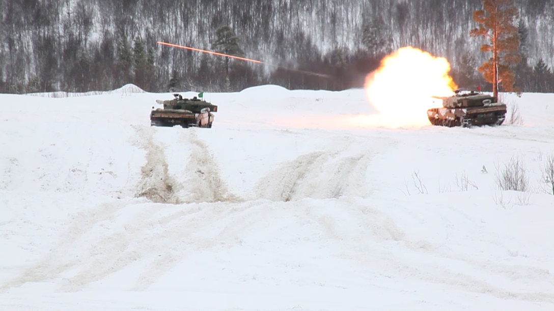 Norwegian tanks take part in a live-fire capabilities demonstration during Cold Response 14, a multinational and multilateral training exercise above the Arctic Circle that brings together more than 14,000 servicemembers from 15 different countries, to include approximately 1,200 NATO personnel, March 11. The Norwegian-led exercise involves maritime, land and air operations being conducted this month to rehearse high-intensity operations in unique winter conditions, showcasing the diplomatic relationships, strategic friendships, and commitment to global security interests of all participating nations. The majority of the servicemembers are participating from the United States, Norway, Canada, France, the Netherlands, Great Britain and Sweden. (Official Air Force Photograph by Tech Sgt. Burt Traynor)