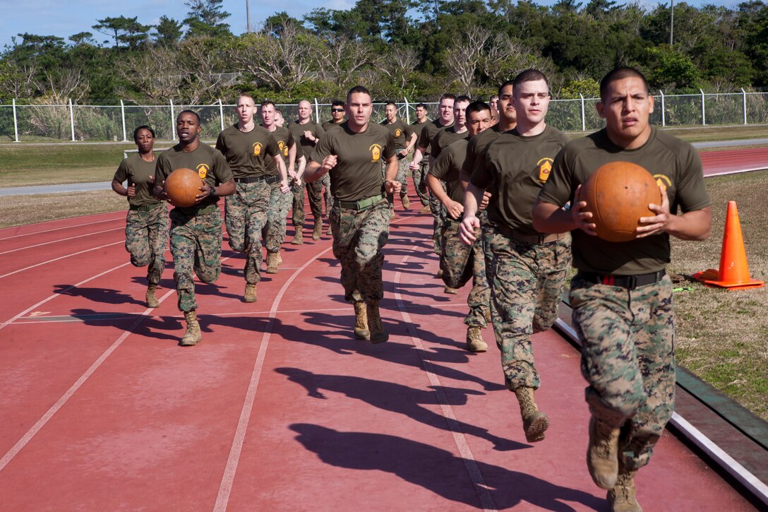 Marines with Staff Noncommissioned Officer Academy Okinawa compete in a relay race Jan. 29 during the Director’s Challenge Field Meet at Camp Hansen. The event tested each Marine’s mental and physical limits while they helped to get their team across the finish line first.


