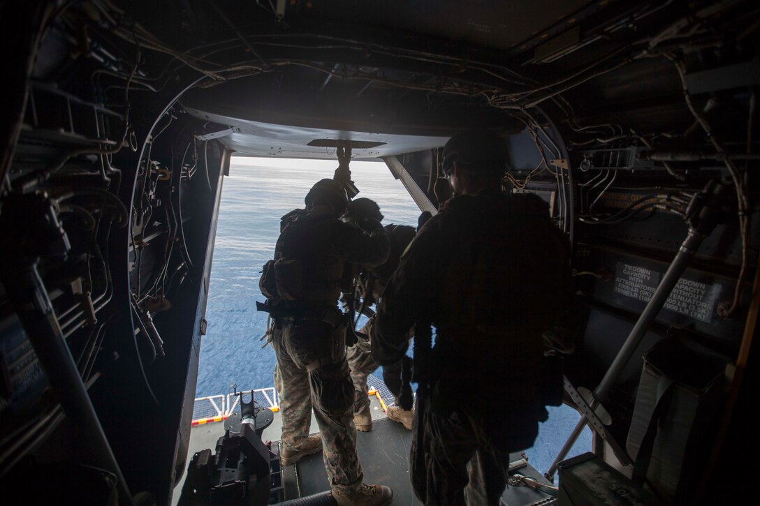 Marines and sailors with the Maritime Raid Force, 31st Marine Expeditionary Unit, prepare to rappel from the back of an MV-22 Osprey onto the port-side elevator of the USS Bonhomme Richard (LHD 6) during a static fast-rope training event here, Mar. 1. The event was in preparation for certification exercises and also gave other Marines and sailors an opportunity to learn the skill. The 31st MEU is currently conducting amphibious integration training alongside Amphibious Squadron 11 while deployed for its regularly scheduled Spring Patrol.