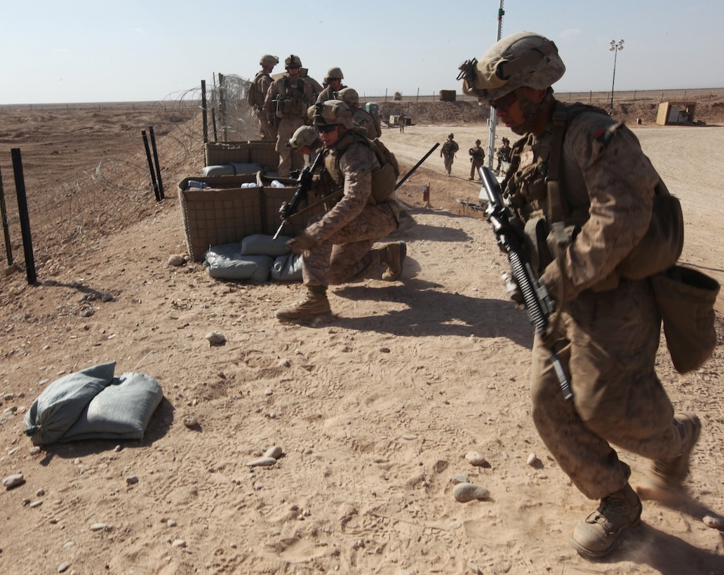 A five-man team of infantry Marines with Charlie Company, 1st Battalion, 9th Marine Regiment, runs to a firing position to defend against a simulated enemy insurgent attack during a life-fire training exercise aboard Camp Leatherneck, Afghanistan, Mar. 6, 2014. The exercise increased confidence in locating and suppressing enemy positions. (U.S. Marine Corps photo by Sgt. Frances Johnson/ Released)
