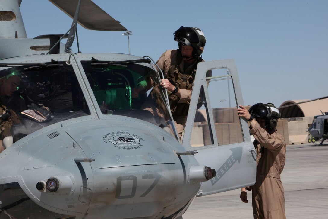 Brigadier Gen. Mark R. Wise, assistant wing commander, 3rd Marine Aircraft Wing, climbs into a UH-1Y Huey on the Camp Bastion flight line as he prepares to co-pilot the aircraft for a mission with Marine Light Attack Helicopter Squadron 369, March 10, 2014. Brigadier Gen. Wise traveled from Marine Corps Air Station Miramar, Calif., to visit the air wing Marines deployed to Regional Command (Southwest) in Helmand province, Afghanistan.