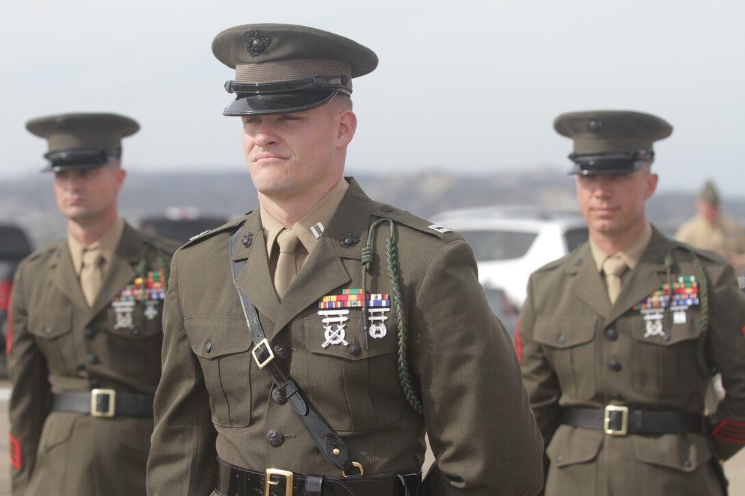 Marines with 2nd Battalion, 4th Marine Regiment, stand at parade rest during a change of command ceremony at Marine Corps Base Camp Pendleton, Calif., March 7, 2014.  Lieutenant Col. Mike Wilonsky assumed command of the battalion from Lt. Col. Robert Weiler. Weiler, a native of Arlington, Va., will be assuming the role of executive officer of 5th Marine Regiment.