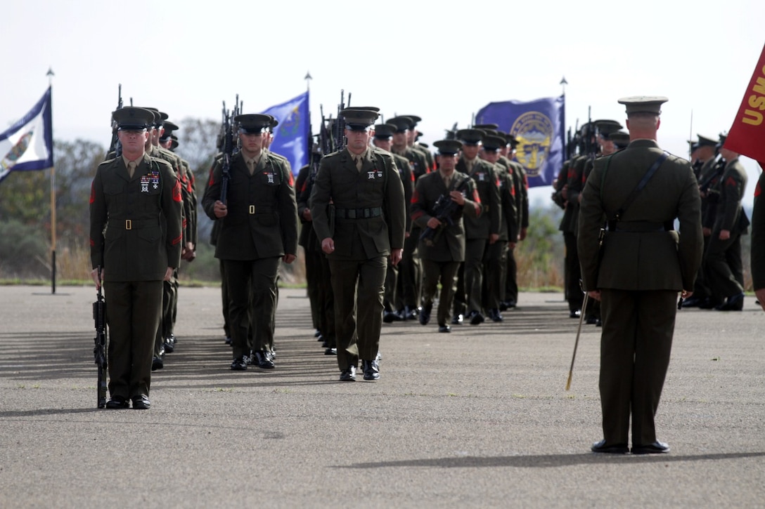 Marines with 2nd Battalion, 4th Marine Regiment, march onto the Camp San Mateo parade deck during a change of command ceremony at Marine Corps Base Camp Pendleton, Calif., March 7, 2014.  Lieutenant Col. Mike Wilonsky assumed command of the battalion from Lt. Col. Robert Weiler. Weiler, a native of Arlington, Va., will be assuming the role of executive officer of 5th Marine Regiment.
