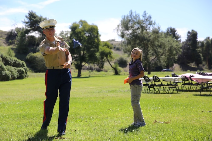 Lieutenant Col. Robert Rice, battalion commander, 3rd Battalion, 5th Marine Regiment, and a native of Richland, Wash., and his daughter Emily, play a bean bag toss game during a father/daughter luncheon aboard Marine Corps Base Camp Pendleton, Calif., March 9, 2014. The luncheon connected the Marines with their daughters and gave them a chance to meet other families in the battalion before they deploy to Okinawa, Japan in April. The event included several games, a cupcake decorating table and a large lunch.