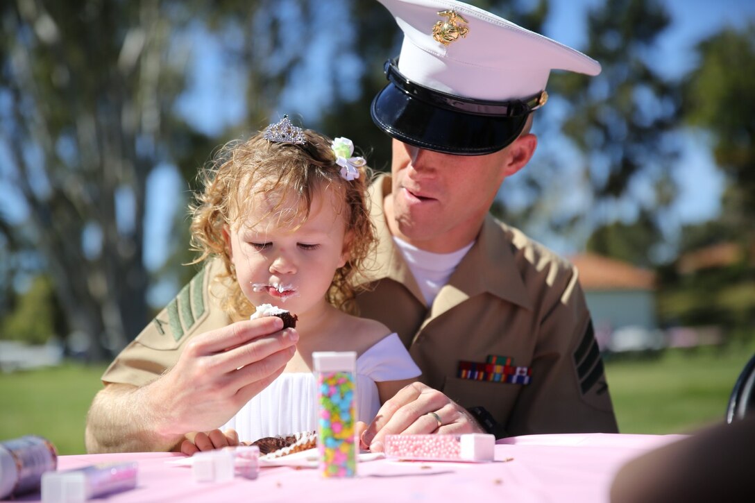 Sergeant Thomas Dilzer, intelligence specialist, Headquarters and Service Company, 3rd Battalion, 5th Marine Regiment during a father/daughter luncheon aboard Marine Corps Base Camp Pendleton, Calif., March 9, 2014. The luncheon connected the Marines with their daughters and gave them a chance to meet other families in the battalion before they deploy to Okinawa, Japan in April. The event included several games, a cupcake decorating table and a large lunch.
