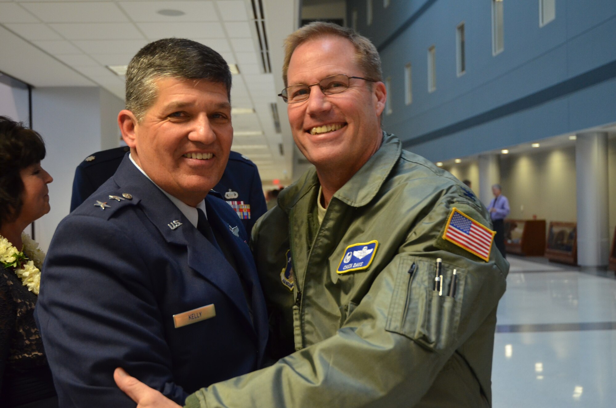 General Officer David Todd Kelly was promoted to the rank of Air Force Maj. Gen. at North Carolina National Guard Joint Force Headquarters on March 7, 2014. Col. Charles Davis, III, Operations Group Commander, NCANG congratulates Kelly on his  new position as Air National Guard Assistant to the Commander, Air Mobility Command at Scott Air Force Base, Ill.  In this capacity, he will be responsible for advising the commander and staff on all issues impacting the ANG nationally. (U.S. Army National Guard Photo by Sgt Leticia Samuels, North Carolina National Guard Public Affairs/Released)