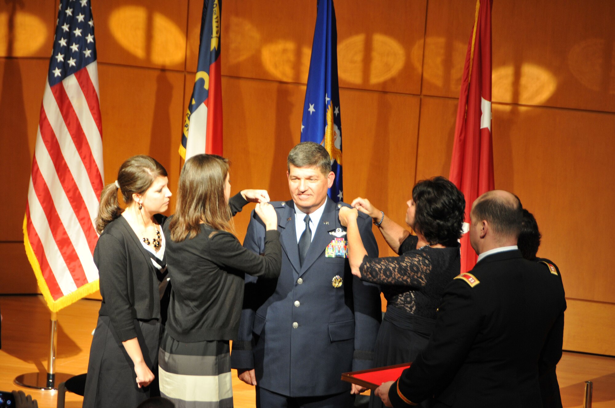 General Officer David Todd Kelly was pinned by his three children Jeremy, Shannon, Melissa and his wife Renee at North Carolina National Guard Joint Force Headquarters, Raleigh, N.C. on March 7, 2014.  Kelly was promoted to the rank of Air Force Maj. Gen. and will serve as the Air National Guard Assistant to the Commander, Air Mobility Command at Scott Air Force Base, IL. (U.S. Air National Guard photo by Master Sgt. Patricia F. Moran, 145th Public Affairs/Released)