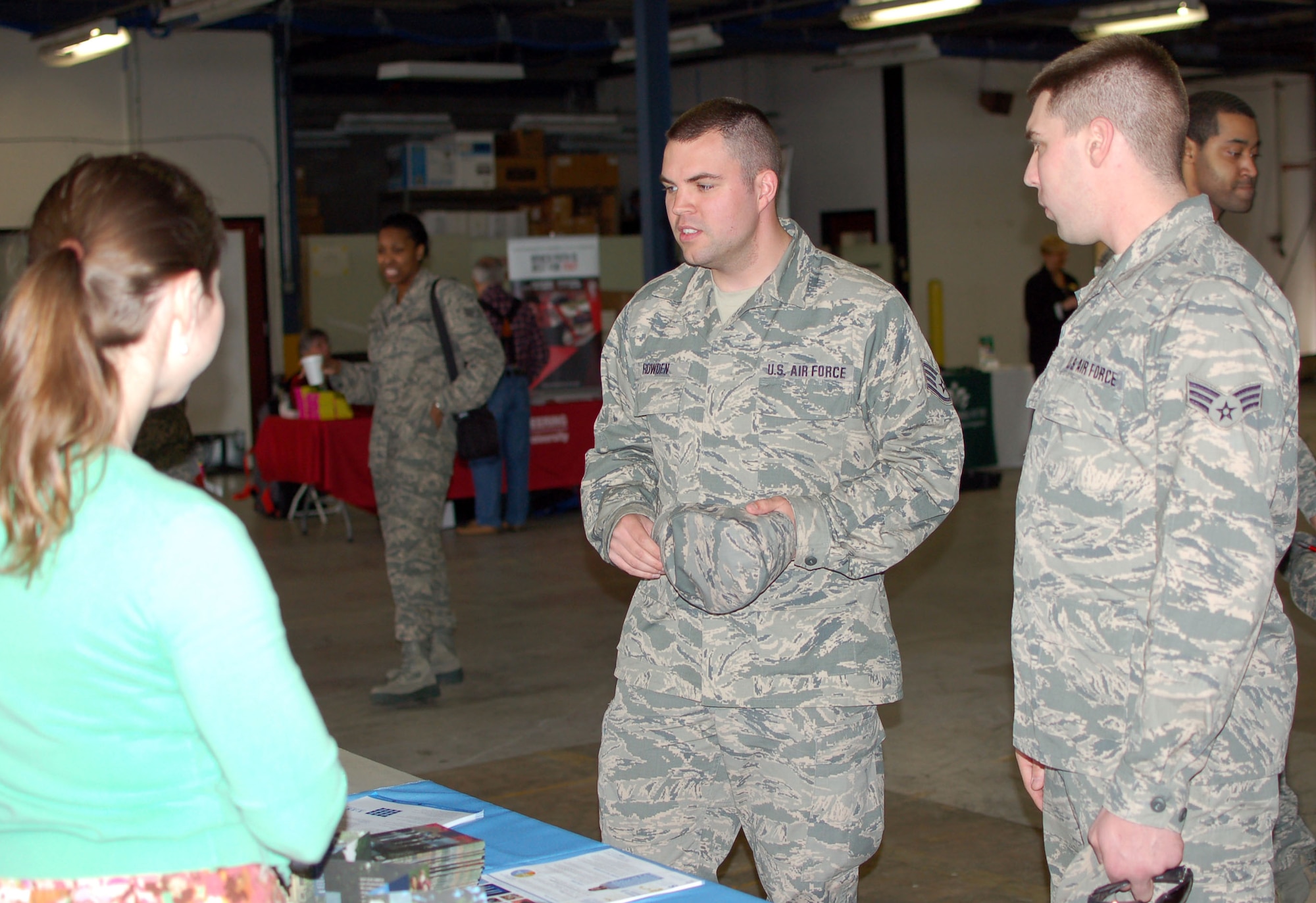 U. S. Air Force Staff Sgt. Ryan Rowden, North Carolina Air National Guard, takes part in a conversation with Patty Baum, Assistant Director of Admissions for the University of North Carolina located in Chapel Hill.  UNC Chapel Hill offers many programs to service men and women.  This annual event was held at the North Carolina Air National Guard base, Charlotte Douglas Intl. airport, March 8, 2014. (U.S. Air National Guard photo by Staff Sgt. Alejandro M. Armendariz, 145th Public Affairs/Released)