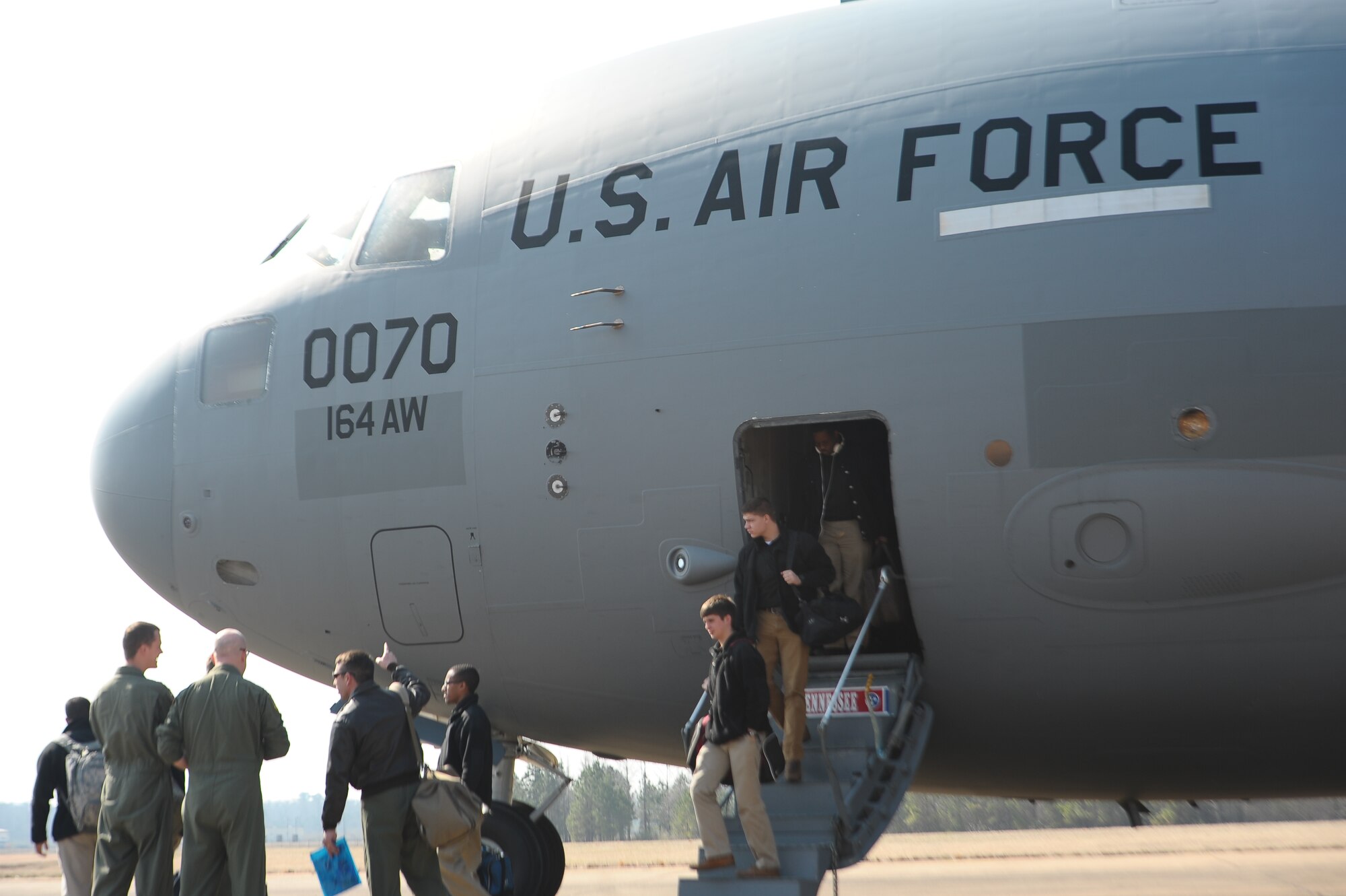 University of Memphis Reserve Officer Training Corps Students from Detachment 785 step off of a C-17 Globemaster III after landing on Columbus Air Force Base March 11. The students were on Columbus AFB for a two-day tour to learn more about life in the Air Force and military careers. (U.S. Air Force Photo/Airman 1st Class Daniel Lile)