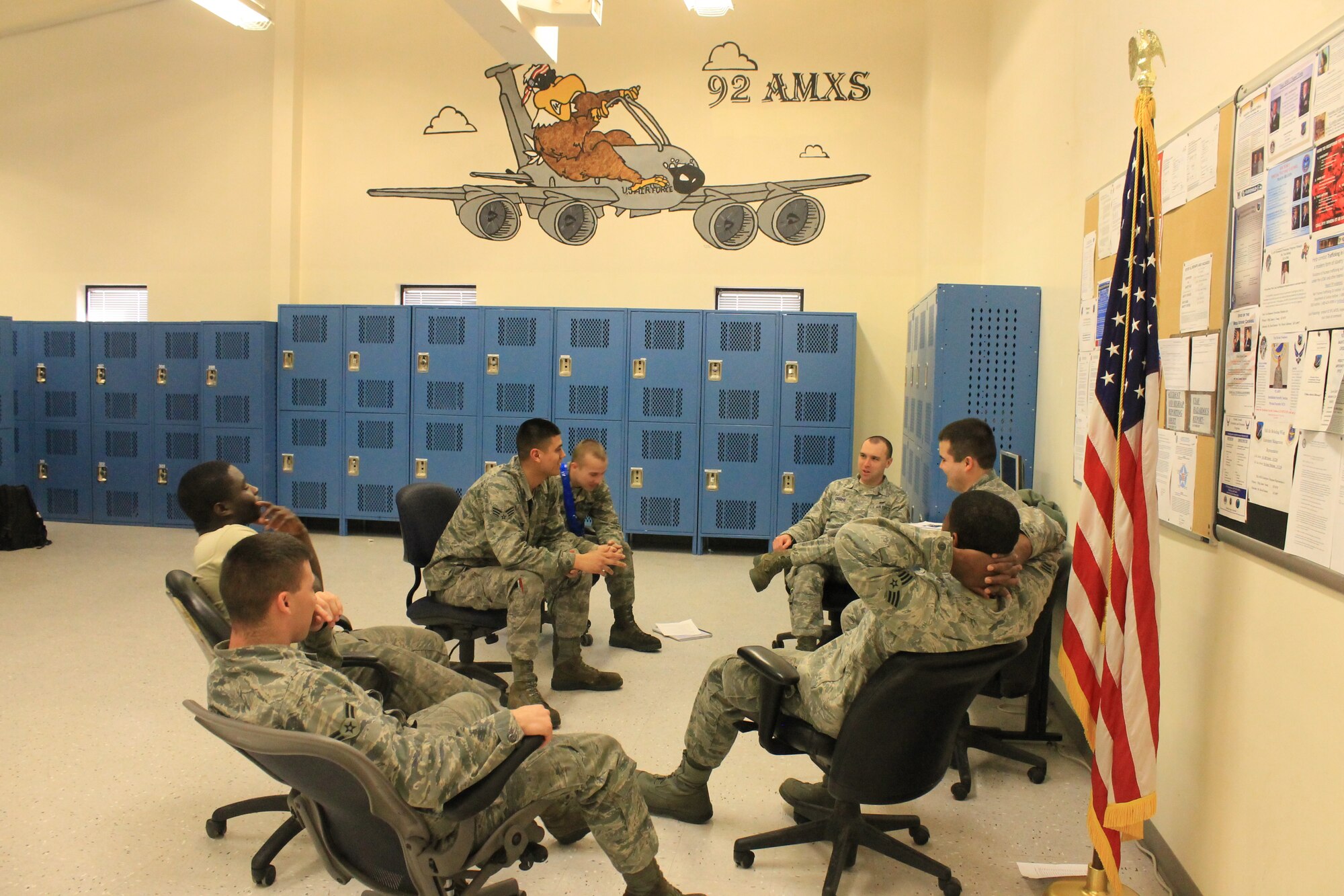 Members from the 92nd Aircraft Maintenance Squadron have small group discussions during Wingman day March 7, 2014, at Fairchild Air Force Base, Wash. Fairchild AFB celebrates Wingman Day biannually to reinforce good Wingman behaviors and the four pillars of Comprehensive Airmen Fitness. (U.S. Air Force photo by Dawn Altmaier/Released)