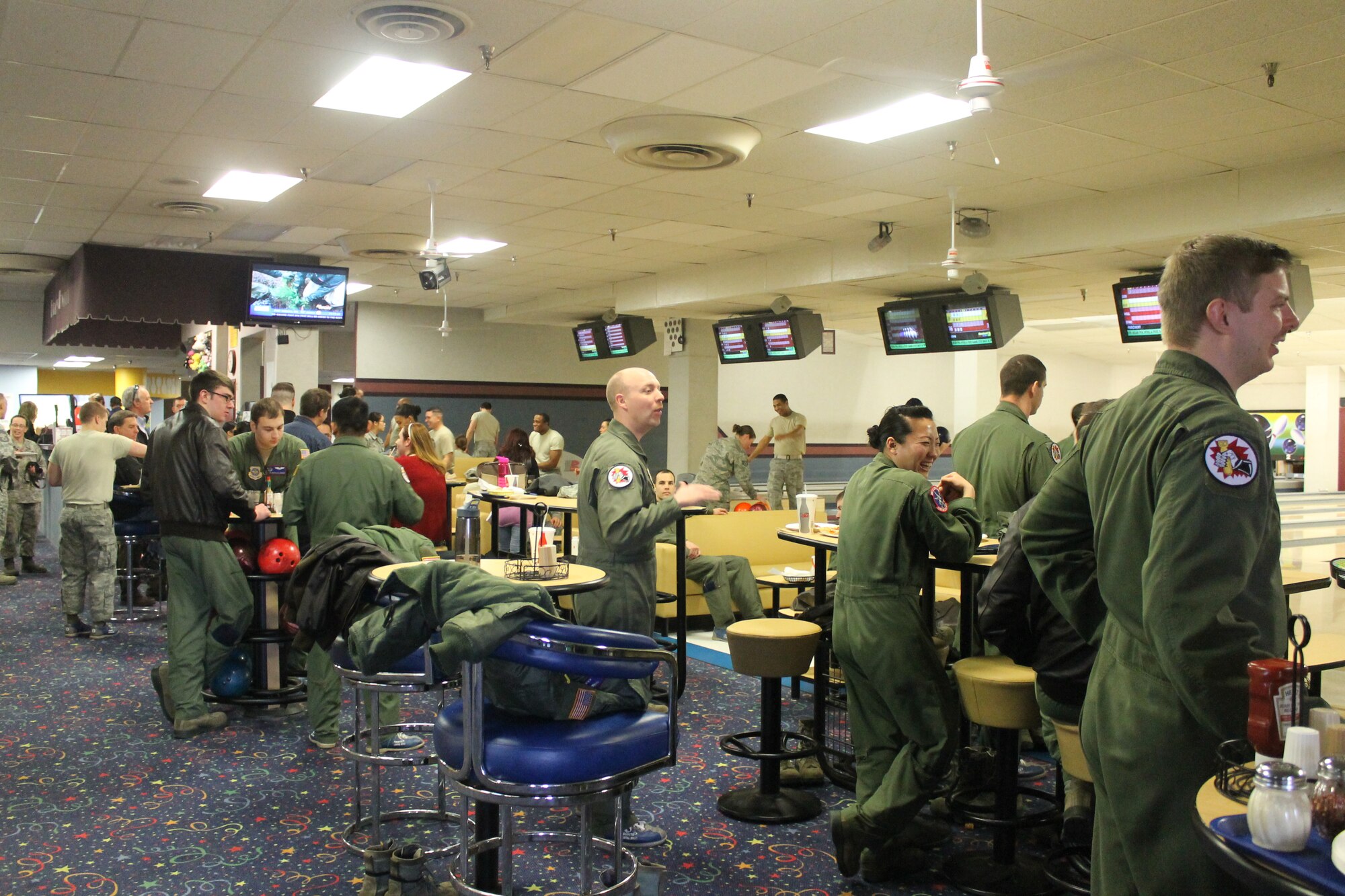 Members from the 93rd Air Refueling Squadron go bowling during Wingman day March 7, 2014, at Fairchild Air Force Base, Wash. Fairchild AFB celebrates Wingman Day biannually to reinforce good Wingman behaviors and the four pillars of Comprehensive Airmen Fitness. (U.S. Air Force photo by Dawn Altmaier/Released)