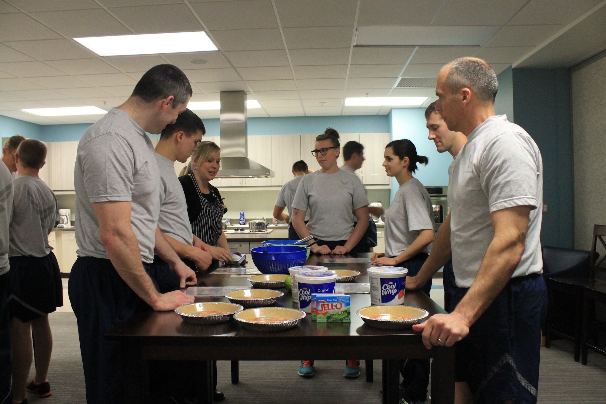 Members from the 92nd Air Refueling Squadron make key lime pie at the Health and Wellness Center during Wingman day March 7, 2014, at Fairchild Air Force Base, Wash. Fairchild AFB celebrates Wingman Day biannually to reinforce good Wingman behaviors and the four pillars of Comprehensive Airmen Fitness. (U.S. Air Force photo by Dawn Altmaier/Released)