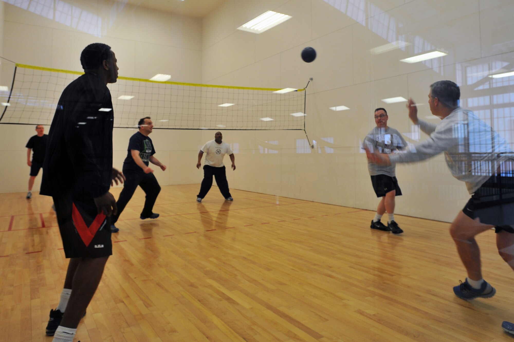 Members from the 92nd Air Refueling Wing Inspector General team participate in a wallyball game during Wingman day March 7, 2014, at Fairchild Air Force Base, Wash. Fairchild AFB celebrates Wingman Day biannually to reinforce good Wingman behaviors and the four pillars of Comprehensive Airmen Fitness. (U.S. Air Force photo by Staff Sgt. Veronica Montes/Released)