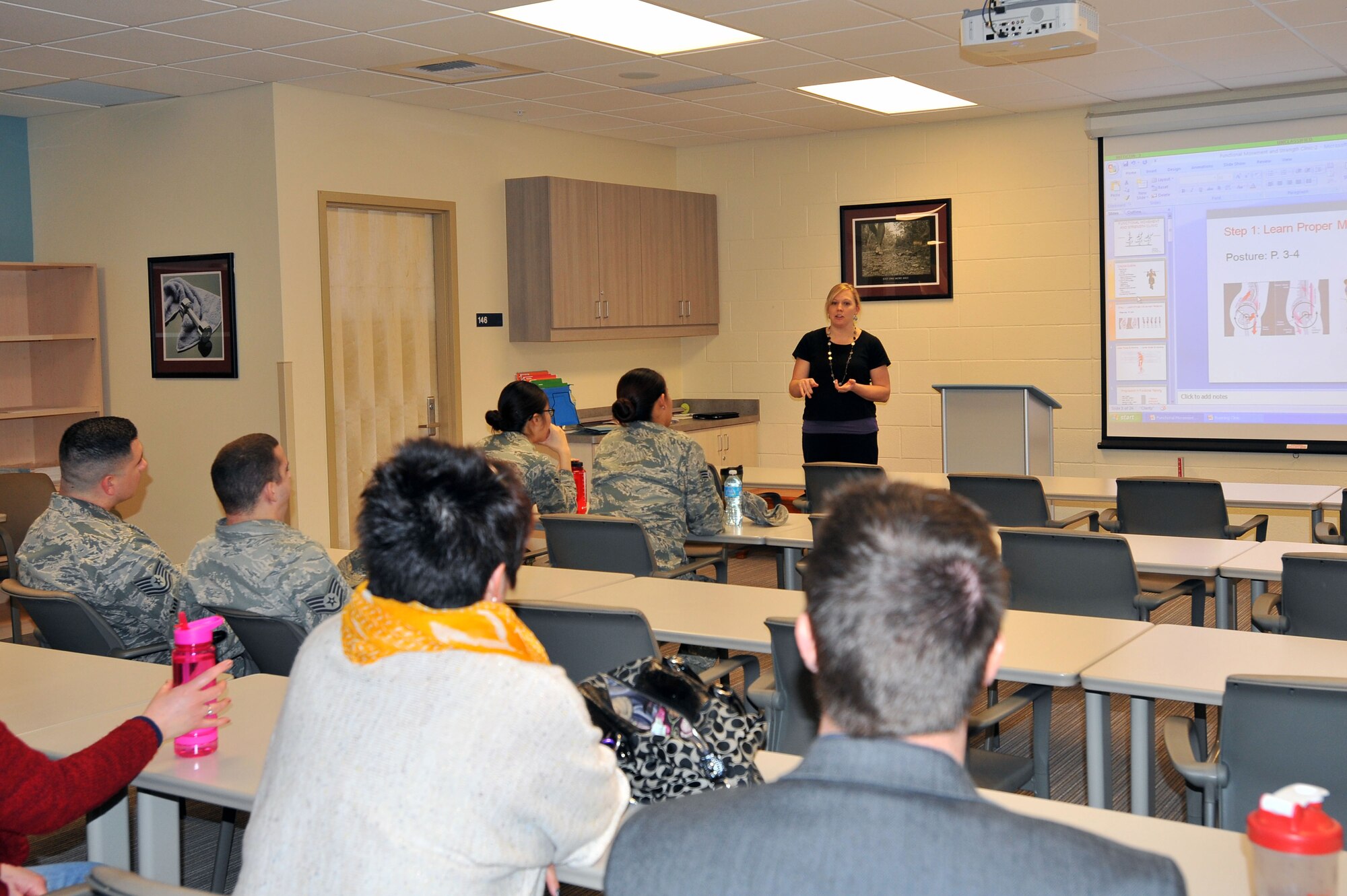 Members from the 92nd Force Support Squadron take a nutrition class during Wingman day March 7, 2014, at Fairchild Air Force Base, Wash. Fairchild AFB celebrates Wingman Day biannually to reinforce good Wingman behaviors and the four pillars of Comprehensive Airmen Fitness. (U.S. Air Force photo by Staff Sgt. Veronica Montes/Released)
