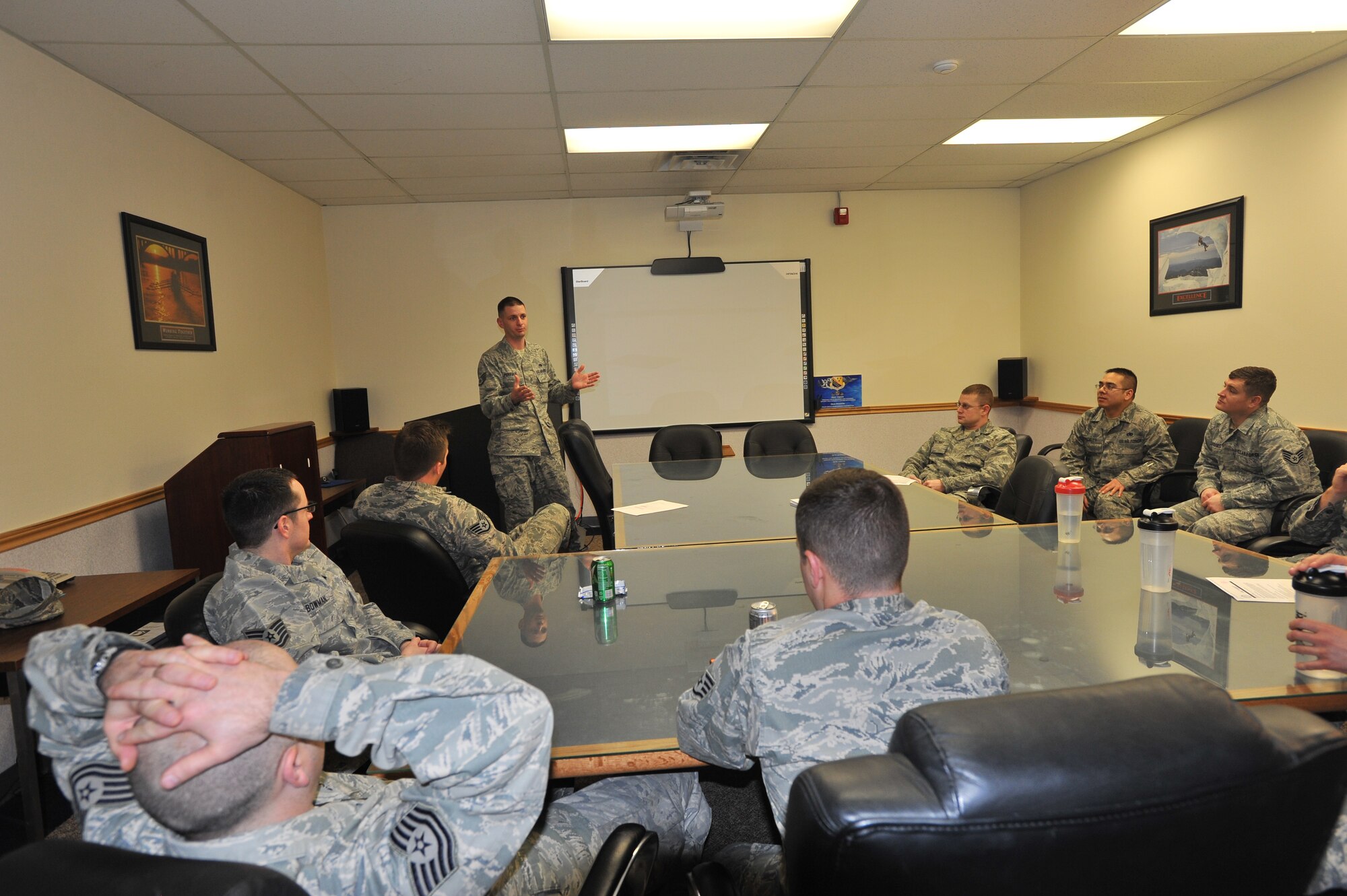 Members from the 373rd Training Squadron detachment 13 have a discussion during Wingman day March 7, 2014, at Fairchild Air Force Base, Wash. Fairchild AFB celebrates Wingman Day biannually to reinforce good Wingman behaviors and the four pillars of Comprehensive Airmen Fitness. (U.S. Air Force photo by Staff Sgt. Veronica Montes/Released)