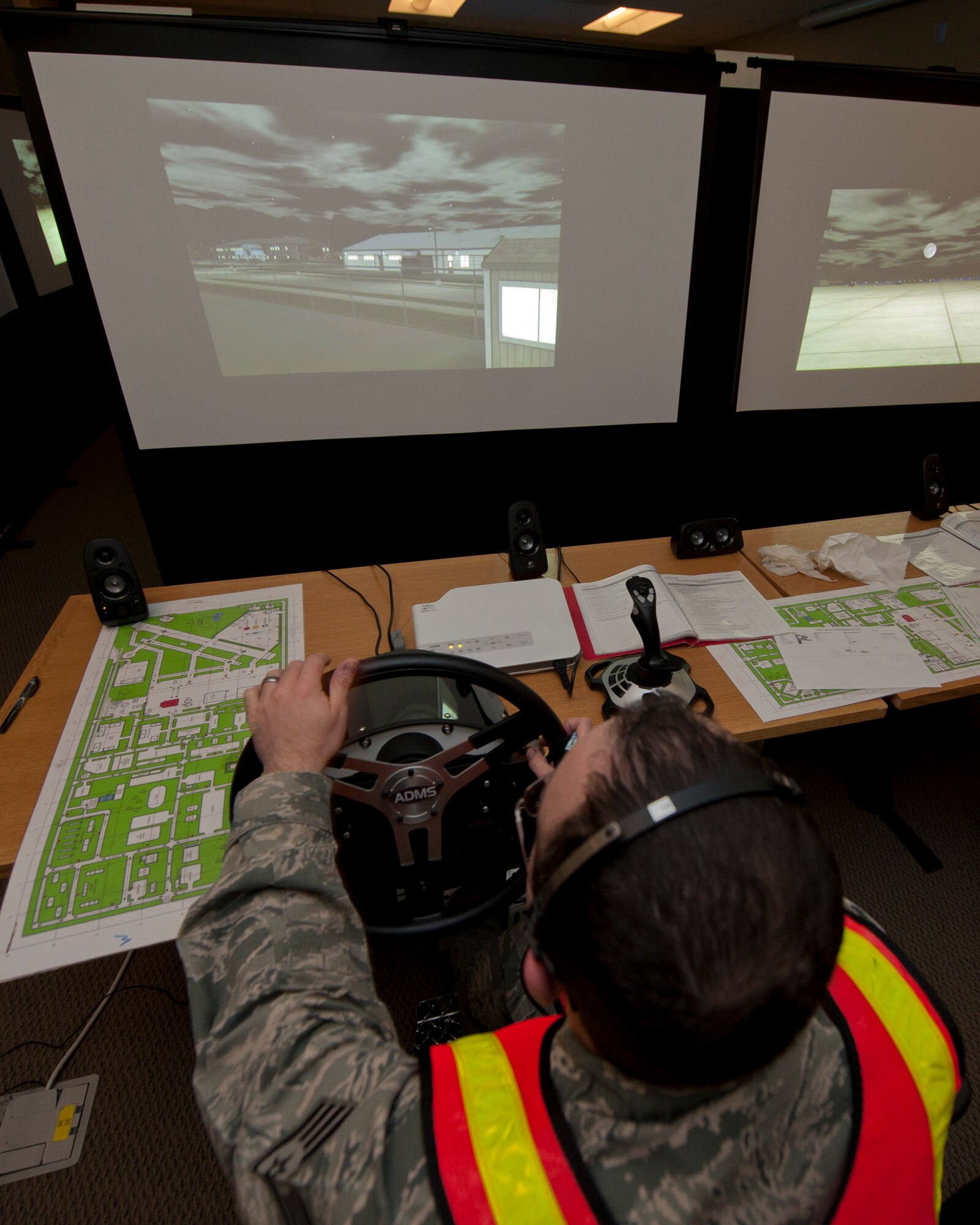 Staff Sgt. Scott Carter, fire protection crew chief, operates a fire engine during a simulated response to an emergency scenario at Holloman Air Force Base, N.M., March 3. Holloman was host to the Department of Defense Fire Officer 2 certification course from the Louis F. Garland DoD Fire Academy at Goodfellow AFB, Texas. Fire Academy instructors from Goodfellow employed the new Advanced Disaster Management Simulator, an interactive video and computer training program allowing each firefighter to assume a higher amount of responsibility when responding to an incident.  (U.S. Air Force photo by Airman 1st Class Aaron Montoya / Released)