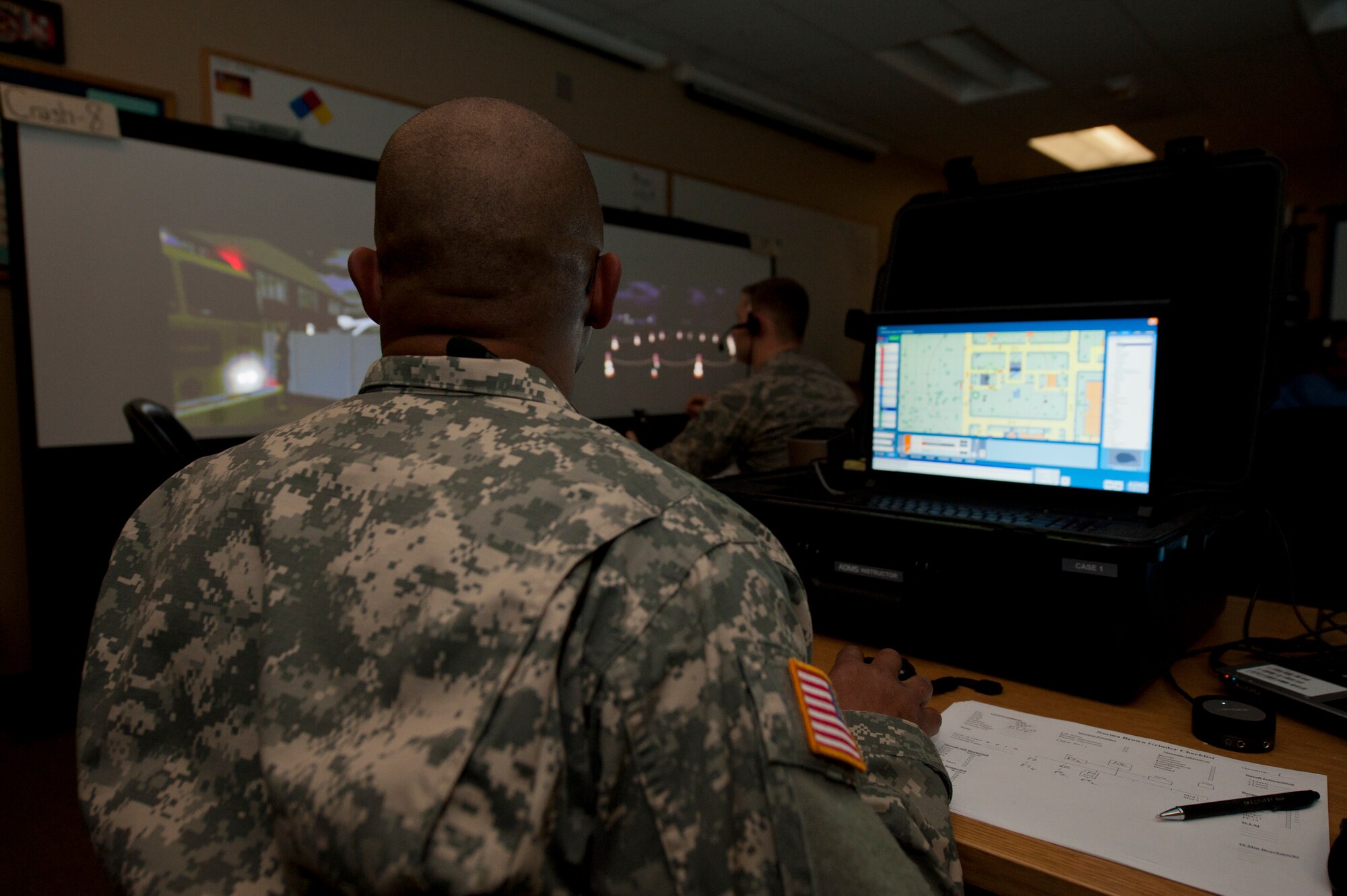 U.S. Army Sergeant 1st Class Brent Roberts, Department of Defense Fire Academy instructor, supervises and assigns roles during a simulated response to emergency scenarios at Holloman Air Force Base, N.M., March 3. Holloman was host to the Department of Defense Fire Officer 2 certification course from the Louis F. Garland DoD Fire Academy at Goodfellow AFB, Texas. Fire Academy instructors from Goodfellow employed the new Advanced Disaster Management Simulator, an interactive video and computer training program allowing each firefighter to assume a higher amount of responsibility when responding to an incident.  (U.S. Air Force photo by Airman 1st Class Aaron Montoya / Released)