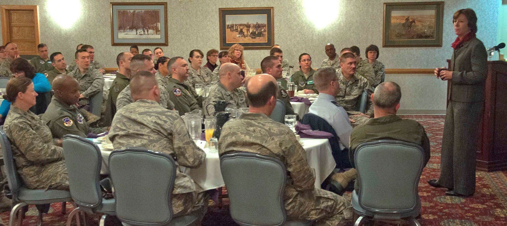 Airmen from the 90th Missile Wing – including the wing leadership – listen to Anne Munch, a lawyer who specializes on SAPR programs for the Department of Defense, as she gives a presentation about sexual assault prevention March 11 in the ball room of the Trail’s End Club. (U.S. Air Force photo by Airman 1st Class Brandon Valle)