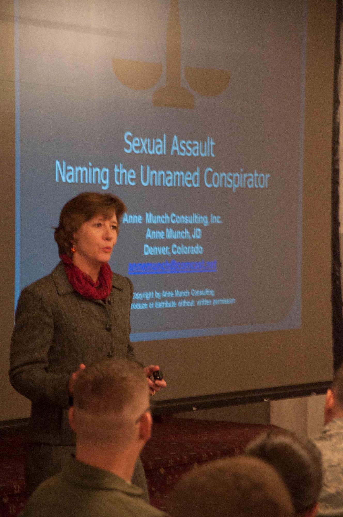 Anne Munch, a lawyer who specializes on SAPR programs for the Department of Defense, speaks to the Airmen of the 90th Missile Wing March 11 during a sexual assault prevention and response awareness event in the ballroom of the Trail’s End Club. Munch focused her lecture, titled “Sexual Assault: Naming the Unnamed Conspirator,” on addressing the influence society has on the ideas and concepts of rape and sexual assault. (U.S. Air Force photo by Airman 1st Class Brandon Valle)