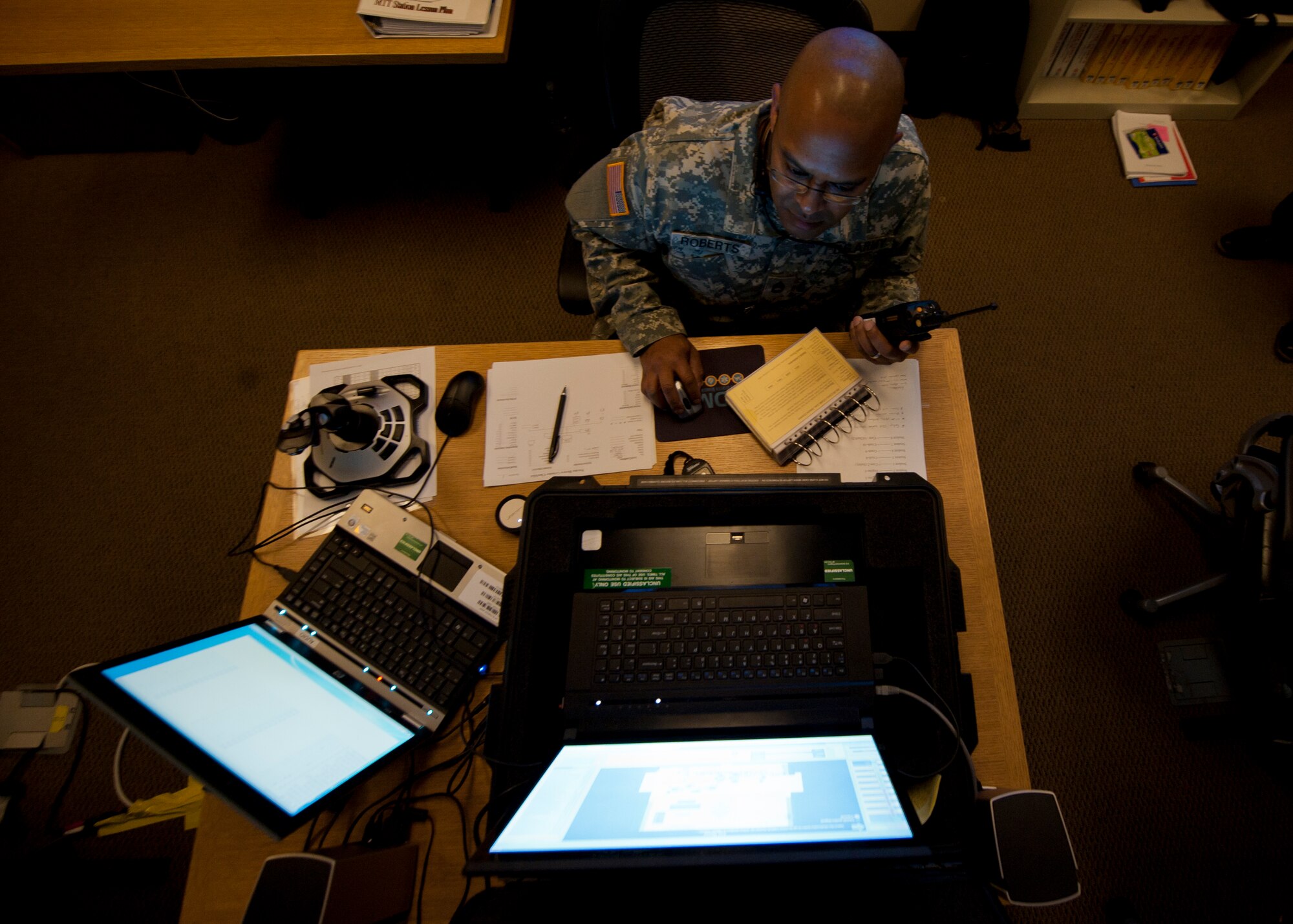 U.S. Army Sergeant 1st Class Brent Roberts, Department of Defense Fire Academy instructor, supervises and assigns roles during a simulated response to emergency scenarios at Holloman Air Force Base, N.M., March 3. Holloman was host to the Department of Defense Fire Officer 2 certification course from the Louis F. Garland DoD Fire Academy at Goodfellow AFB, Texas. Fire Academy instructors from Goodfellow employed the new Advanced Disaster Management Simulator, an interactive video and computer training program allowing each firefighter to assume a higher amount of responsibility when responding to an incident.  (U.S. Air Force photo by Airman 1st Class Aaron Montoya / Released)