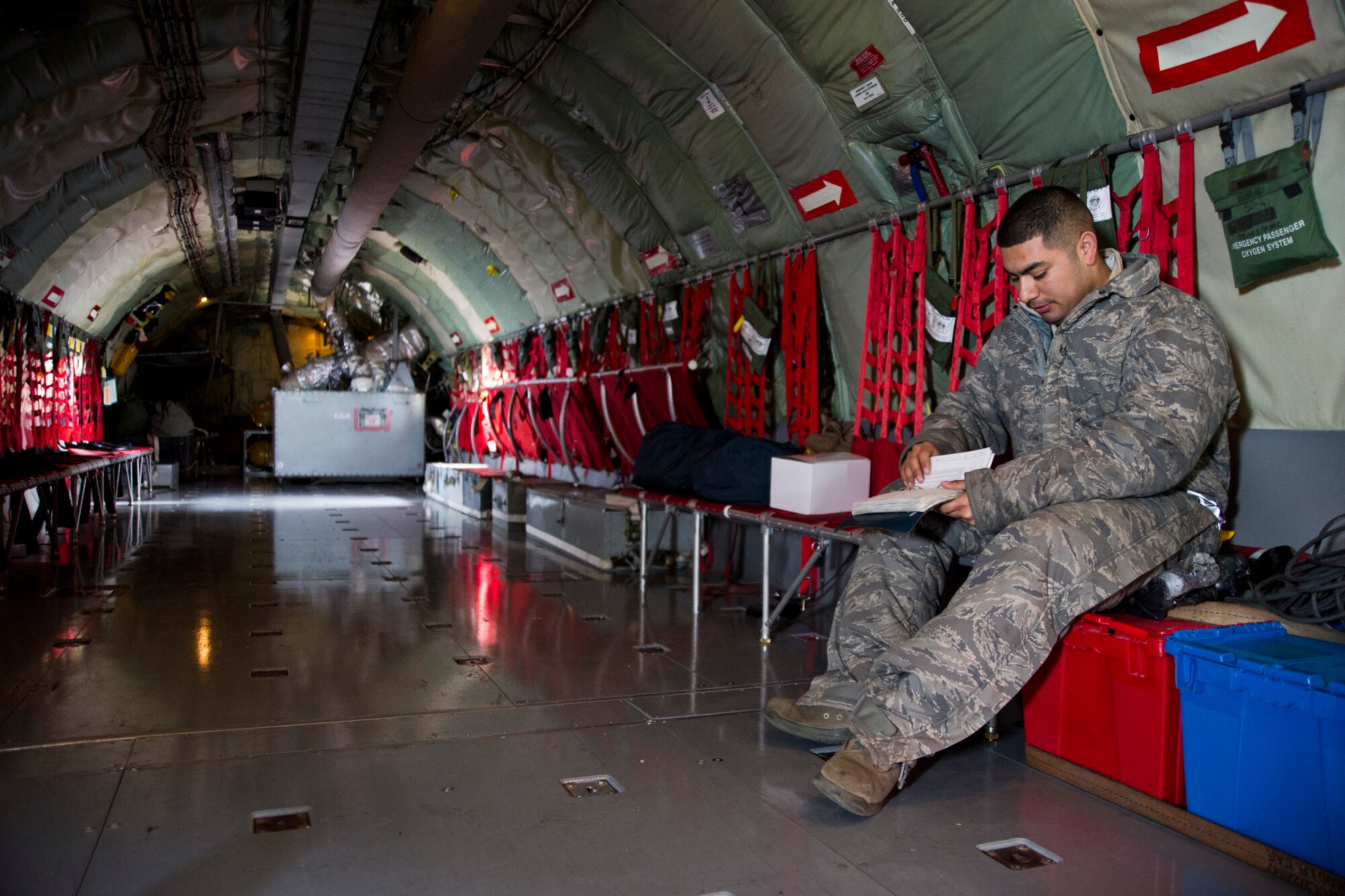 Staff Sgt. Wilfredo Zelaya, 22nd Aircraft Maintenance Squadron flying crew chief, looks through flight-inspection-work cards Jan. 30, 2014, aboard a KC-135 Stratotanker assigned to McConnell Air Force Base, Kan. Flying crew chiefs come from various maintenance career fields and travel with aircrew to keep aircraft mission-ready. (U.S. Air Force photo/Airman 1st Class John Linzmeier)