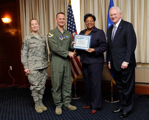 Ms. Pamela Creekmur, second from the right, Health Director Prince George’s County, receives an honorary commander’s induction certificate from Col. Bill Knight, 11th Wing commander, and Mr. Jim Estepp, JBA senior honorary commander, far right, during a ceremony on Joint Base Andrews, Md., March 7, 2014. Creekmur is the honorary commander for the 779th Aerospace Medical Squadron. She is joined by Chief Master Sgt. Michelle Thorsteinson-Richards, 79 Medical Wing Command Chief, far left. (U.S. Air Force photo/ Airman 1st Class Nesha Humes)