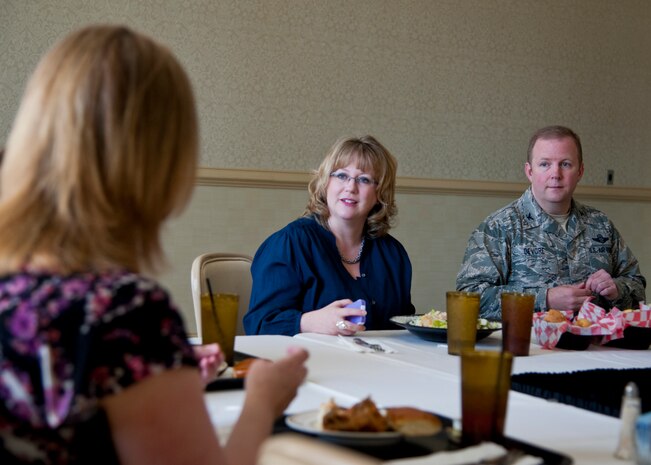 Col. Jeffery DeVore, Joint Base Charleston commander, and his wife Michelle, (center), discuss various issues with a spouse during a Key Spouse luncheon March 11, 2014, at the Charleston Club on Joint Base Charleston – Air Base, S.C. The Key Spouse Program is made up of specially trained volunteers that promote individual, family and unit readiness. They promote the vital needs of spouses and provide an informal sounding board through an informal network as part of the leadership team in each unit (U.S. Air Force photo/Staff Sgt. William O’Brien