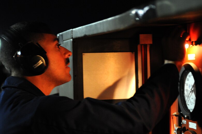 U.S. Air Force Staff Sgt. Jesuel Rosa Castillo, a 20th Aircraft Maintenance Squadron F-16 Fighting Falcon crew chief at Shaw Air Force Base, S.C., adjusts gauges during nighttime maintenance operations, March 11, 2014, at Nellis Air Force Base, Nev. Rosa Castillo and more than 100 other maintenance and support personnel participated in Red Flag 14-2 March 1-14. (Air Force photo/Staff Sgt. Chuck Broadway)